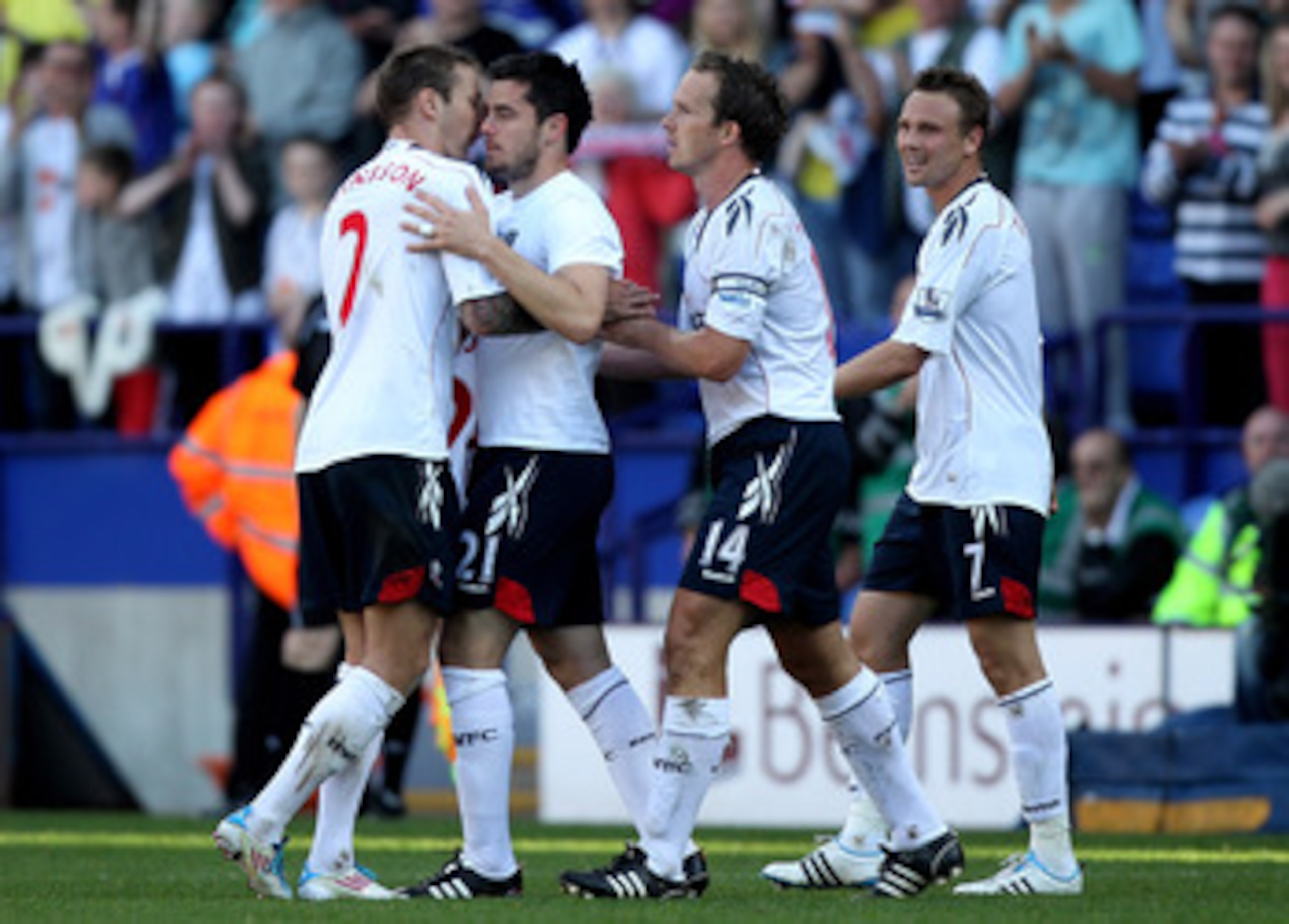 BOLTON, ENGLAND - APRIL 24:  Tamir Cohen of Bolton Wanderers is congratulated by his team mates after scoring the winning goal during the Barclays Premier League match between Bolton Wanderers and Arsenal at the Reebok Stadium on April 24, 2011 in Bolton,