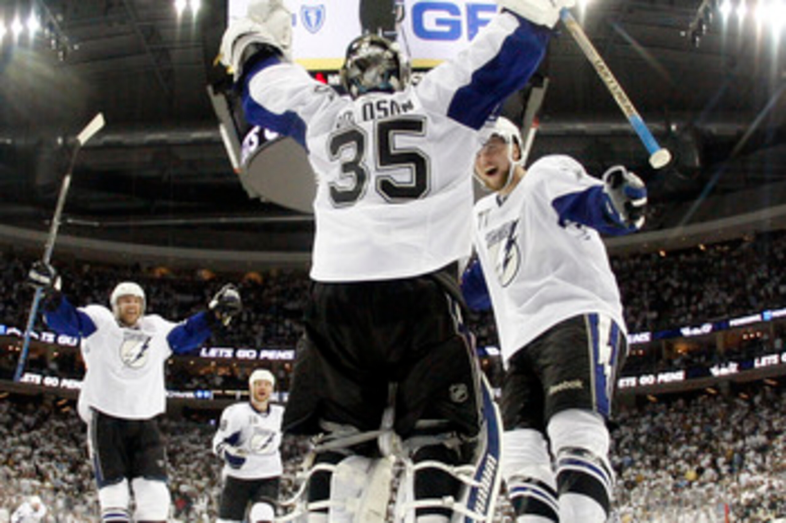 PITTSBURGH, PA - APRIL 27:  Dwayne Roloson #35 of the Tampa Bay Lightning celebrates the win over the Pittsburgh Penguins with Victor Hedman #77 after Game Seven of the Eastern Conference Quarterfinals during the 2011 NHL Stanley Cup Playoffs at Consol En