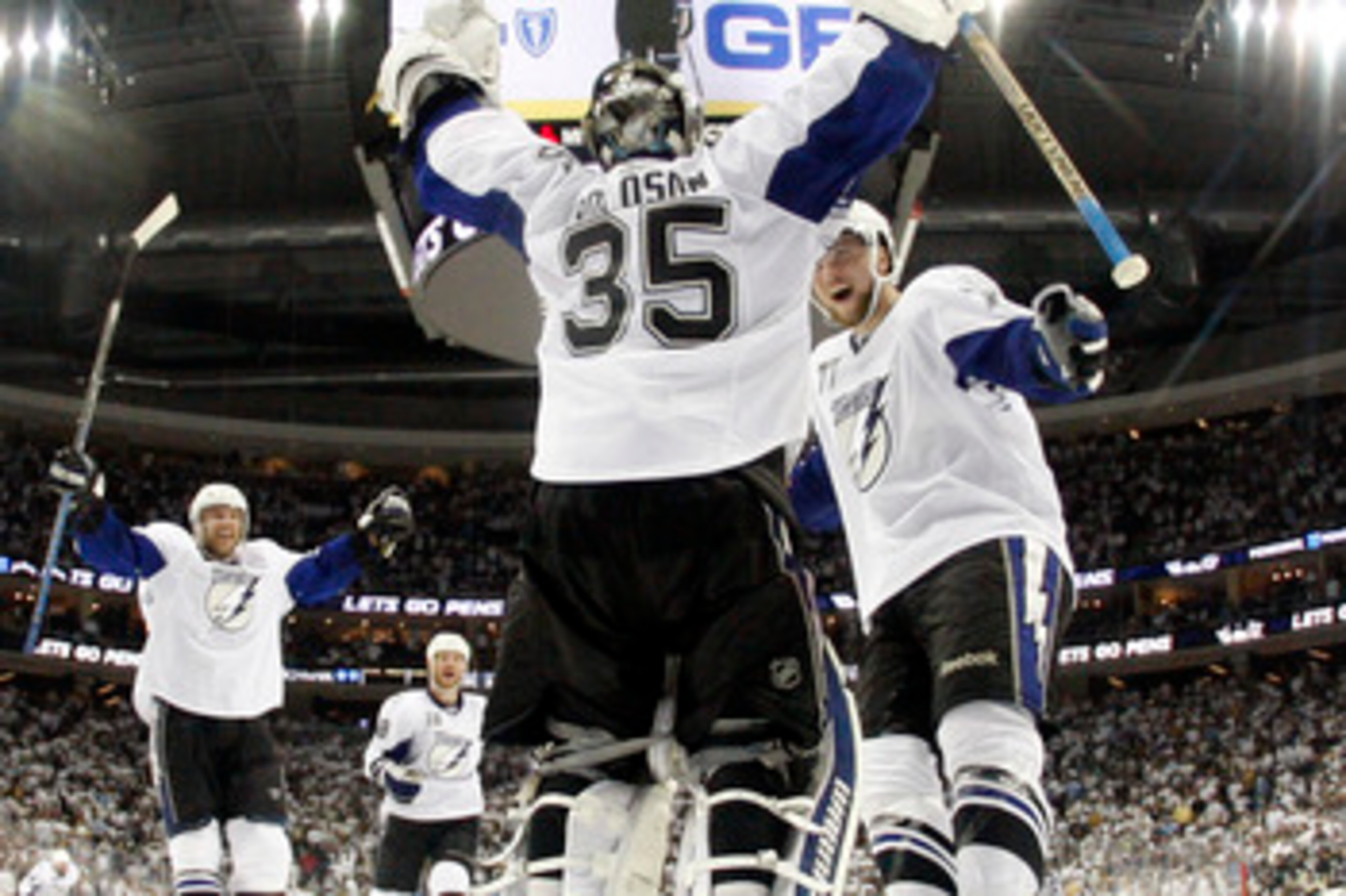 PITTSBURGH, PA - APRIL 27:  Dwayne Roloson #35 of the Tampa Bay Lightning celebrates the win over the Pittsburgh Penguins with Victor Hedman #77 after Game Seven of the Eastern Conference Quarterfinals during the 2011 NHL Stanley Cup Playoffs at Consol En