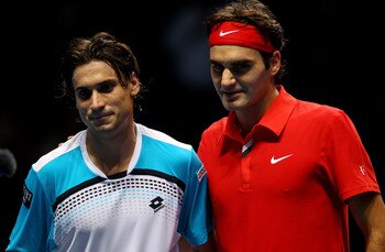 LONDON, ENGLAND - NOVEMBER 21:  Roger Federer of Switzerland (R) and  David Ferrer of Spain pose for press on court after their men's singles first round match during the Barclays ATP World Tour Finals at O2 Arena on November 21, 2010 in London, England. 