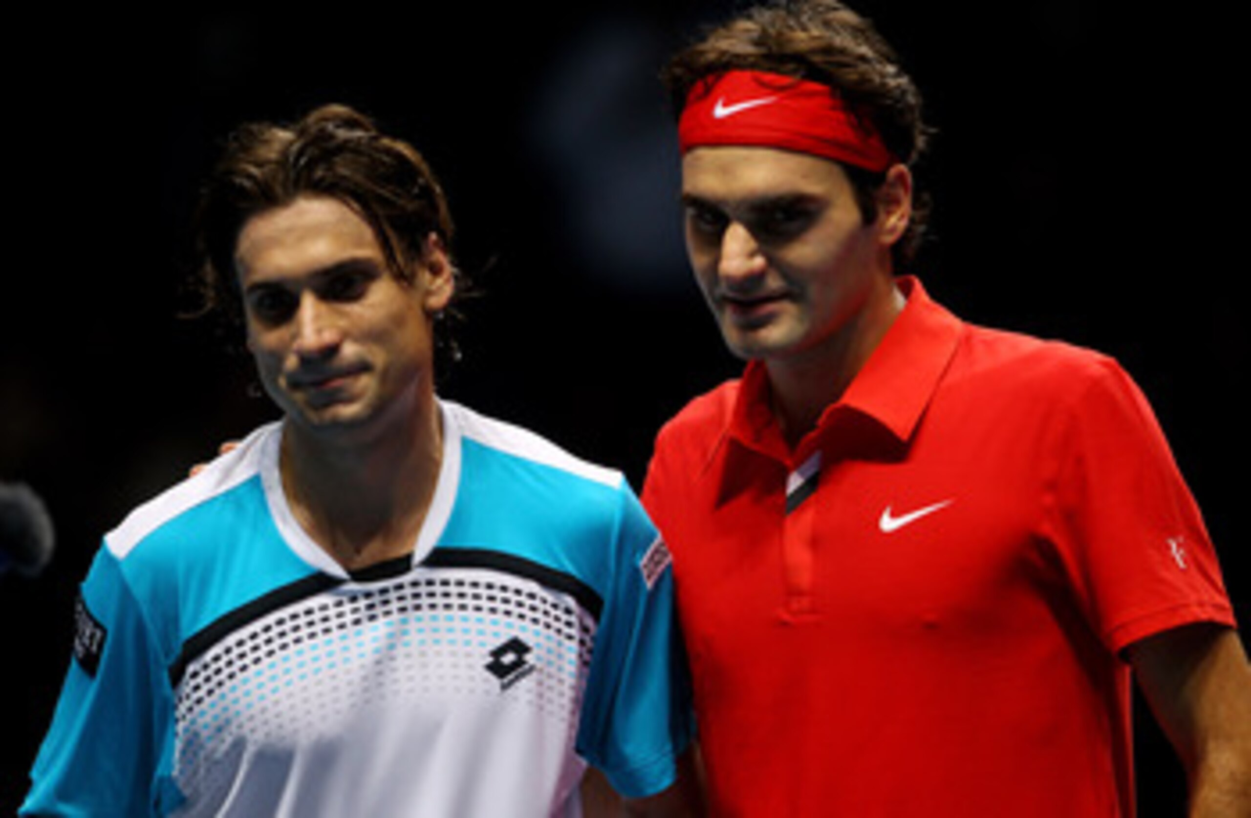 LONDON, ENGLAND - NOVEMBER 21:  Roger Federer of Switzerland (R) and  David Ferrer of Spain pose for press on court after their men's singles first round match during the Barclays ATP World Tour Finals at O2 Arena on November 21, 2010 in London, England. 