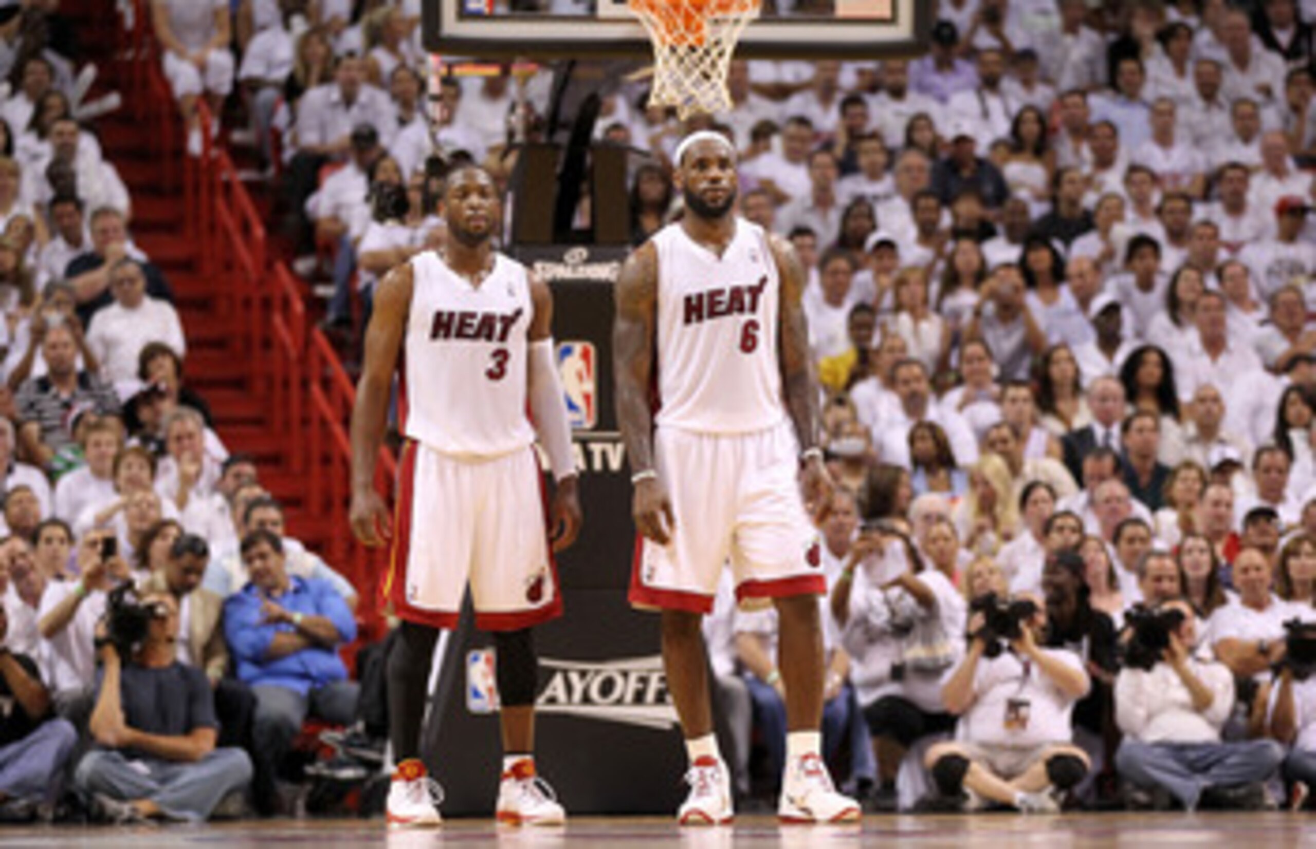 MIAMI, FL - APRIL 27:  Dwyane Wade #3 and LeBron James #6 of the Miami Heat talk during game five of the Eastern Conference Quarterfinals in the 2011 NBA Playoffs against the Philadelphia 76ers at American Airlines Arena on April 27, 2011 in Miami, Florid