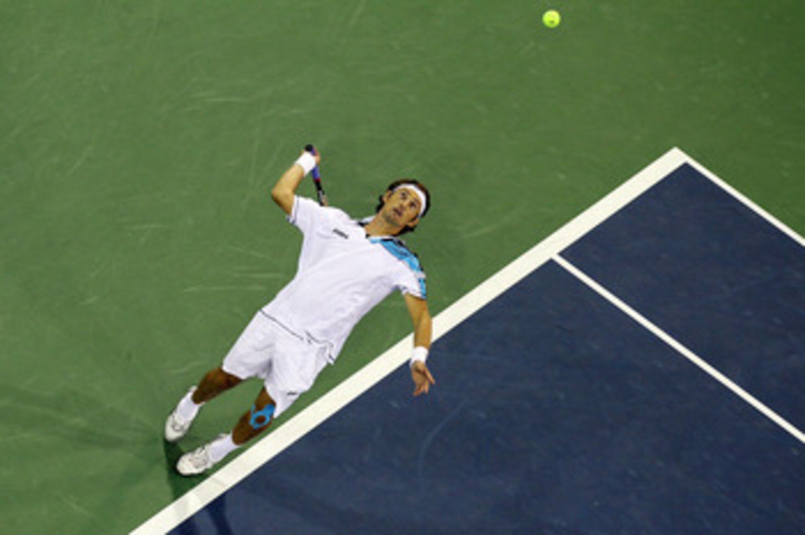 NEW YORK - SEPTEMBER 04:  Juan Carlos Ferrero of Spain serves against Jurgen Melzer of Austria during his men's singles match on day six of the 2010 U.S. Open at the USTA Billie Jean King National Tennis Center on September 4, 2010 in the Flushing neighbo