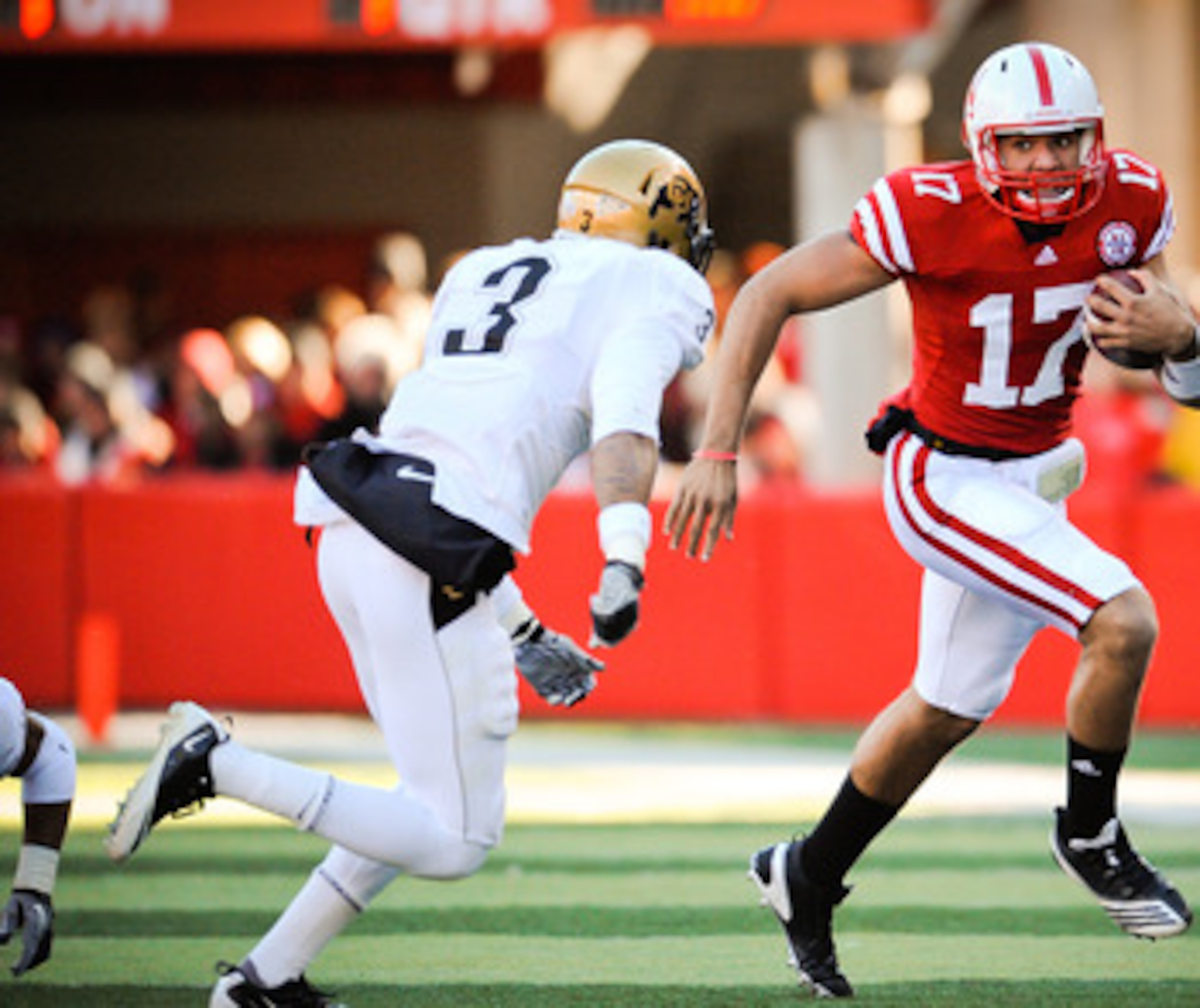 LINCOLN, NE - NOVEMBER 26: Cody Green #17 of the Nebraska Cornhuskers slips past Jimmy Smith #3 of the Colorado Buffaloes during their game at Memorial Stadium on November 26, 2010 in Lincoln, Nebraska. Nebraska defeated Colorado 45-17 (Photo by Eric Fran
