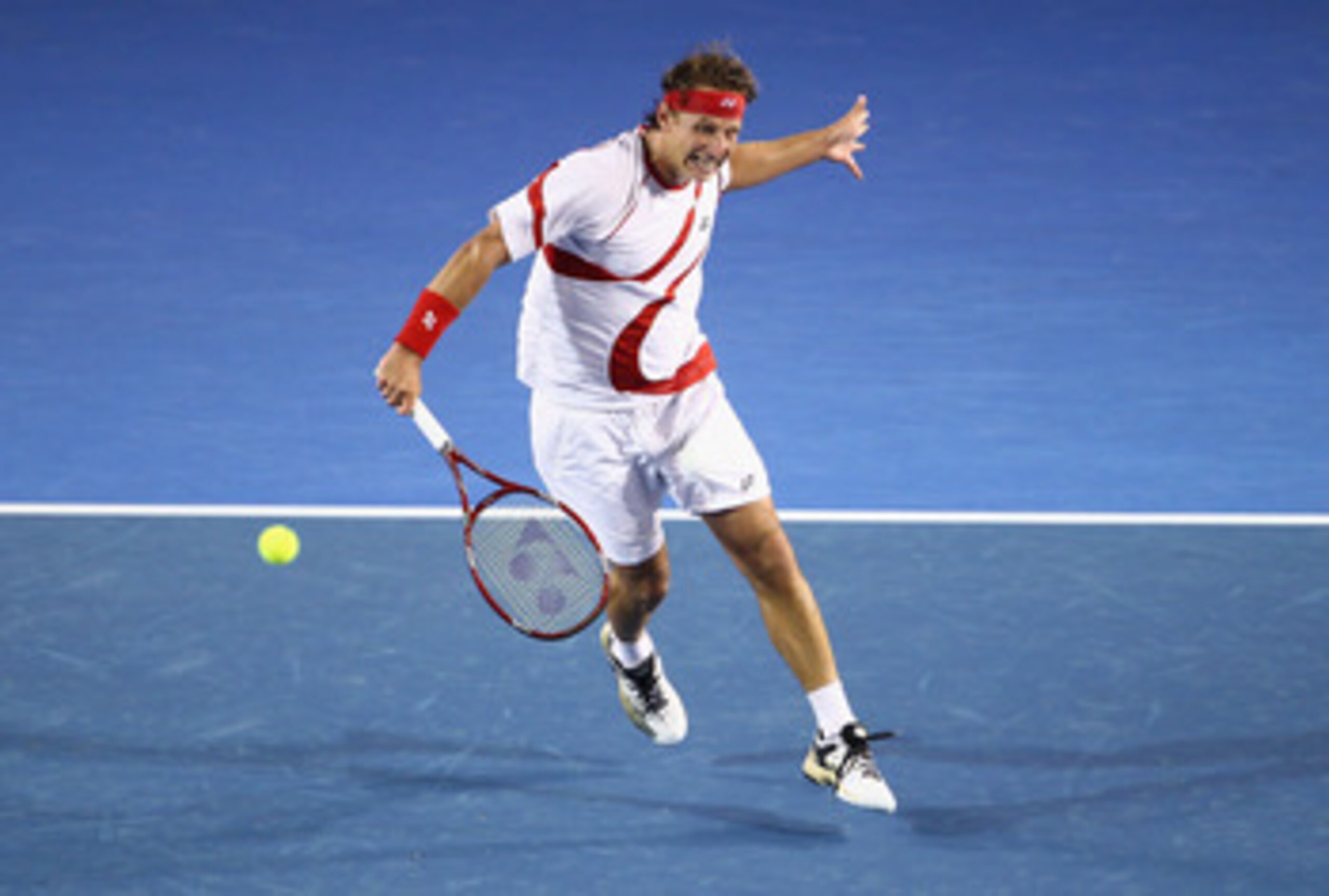 MELBOURNE, AUSTRALIA - JANUARY 18:  David Nalbandian of Argentina plays a forehand in his first round match against  Lleyton Hewitt of Australia during day two of the 2011 Australian Open at Melbourne Park on January 18, 2011 in Melbourne, Australia.  (Ph