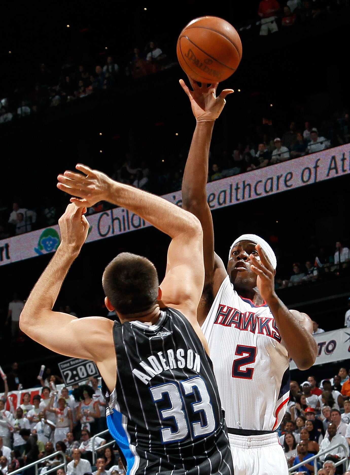ATLANTA, GA - APRIL 24:  Joe Johnson #2 of the Atlanta Hawks shoots over Ryan Anderson #33 of the Orlando Magic during Game Four of the Eastern Conference Quarterfinals in the 2011 NBA Playoffs at Philips Arena on April 24, 2011 in Atlanta, Georgia.  NOTE