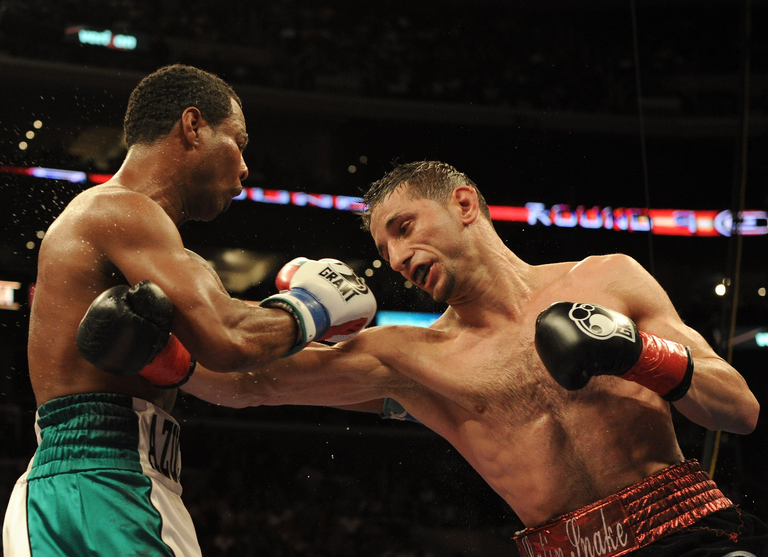 LOS ANGELES, CA - SEPTEMBER 18:  Sergio Mora hits Shane Mosley during the ninth round of the Middleweight bout at Staples Center on September 18, 2010 in Los Angeles, California.  The fight ended in a draw.  (Photo by Harry How/Getty Images)