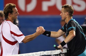 MELBOURNE, AUSTRALIA - JANUARY 18:  Lleyton Hewitt of Australia conrgratulates David Nalbandian of Argentina on his victory in their first round match during day two of the 2011 Australian Open at Melbourne Park on January 18, 2011 in Melbourne, Australia