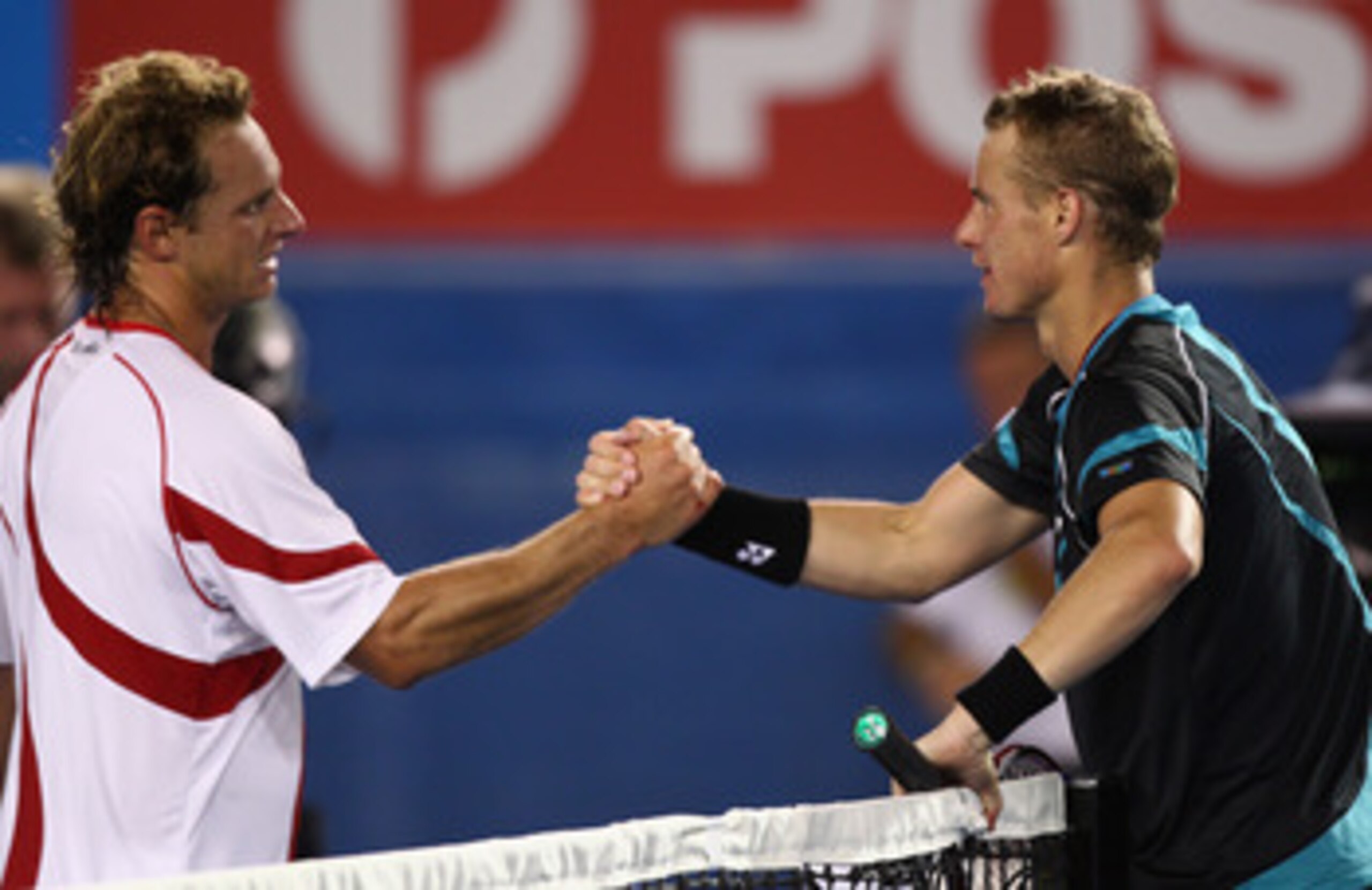 MELBOURNE, AUSTRALIA - JANUARY 18:  Lleyton Hewitt of Australia conrgratulates David Nalbandian of Argentina on his victory in their first round match during day two of the 2011 Australian Open at Melbourne Park on January 18, 2011 in Melbourne, Australia