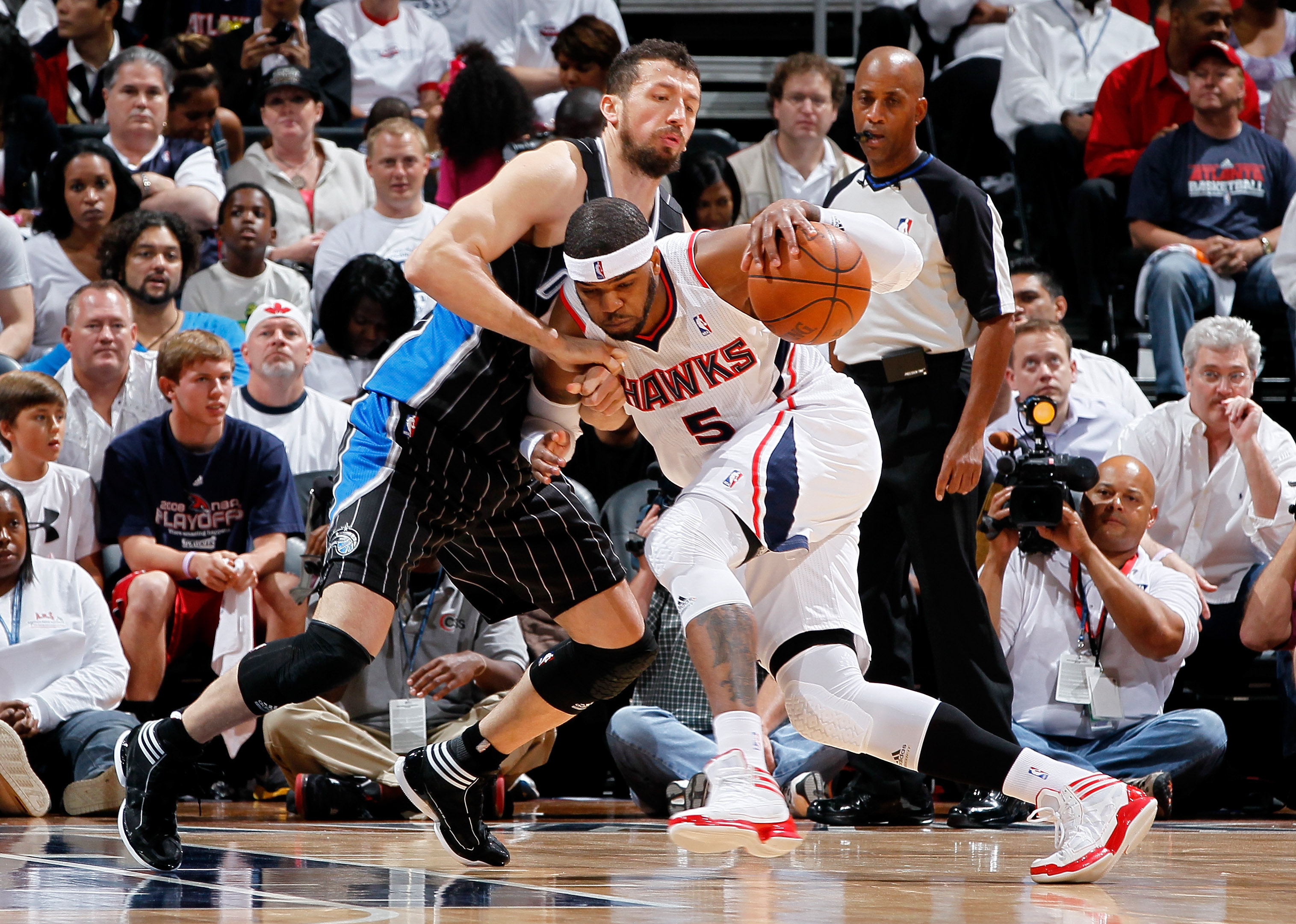 ATLANTA, GA - APRIL 28:  Josh Smith #5 of the Atlanta Hawks drives against Hedo Turkoglu #15 of the Orlando Magic during Game Six of the Eastern Conference Quarterfinals in the 2011 NBA Playoffs at Philips Arena on April 28, 2011 in Atlanta, Georgia.  NOT