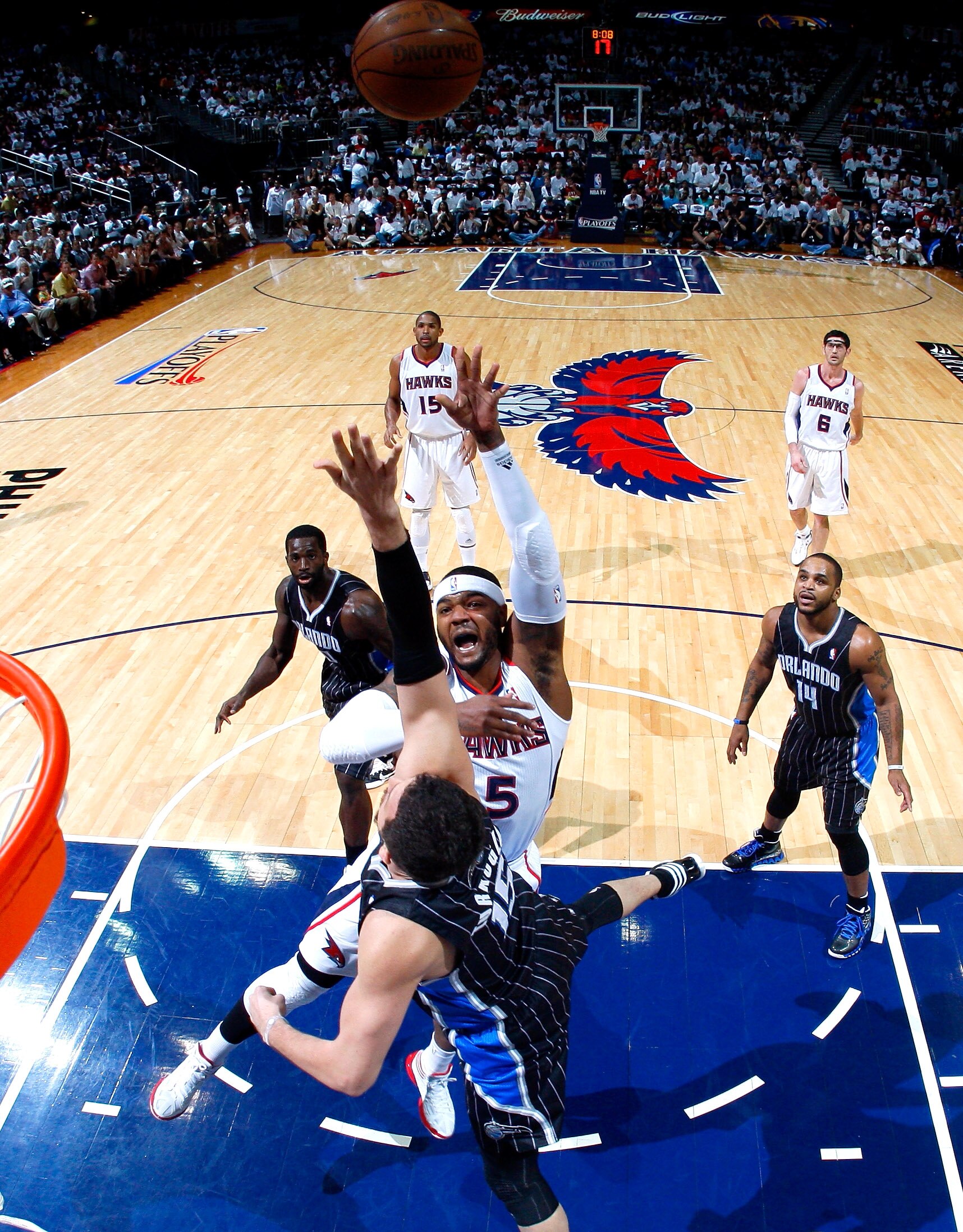 ATLANTA, GA - APRIL 24:  Josh Smith #5 of the Atlanta Hawks shoots over Hedo Turkoglu #15 of the Orlando Magic during Game Four of the Eastern Conference Quarterfinals in the 2011 NBA Playoffs at Philips Arena on April 24, 2011 in Atlanta, Georgia.  NOTE