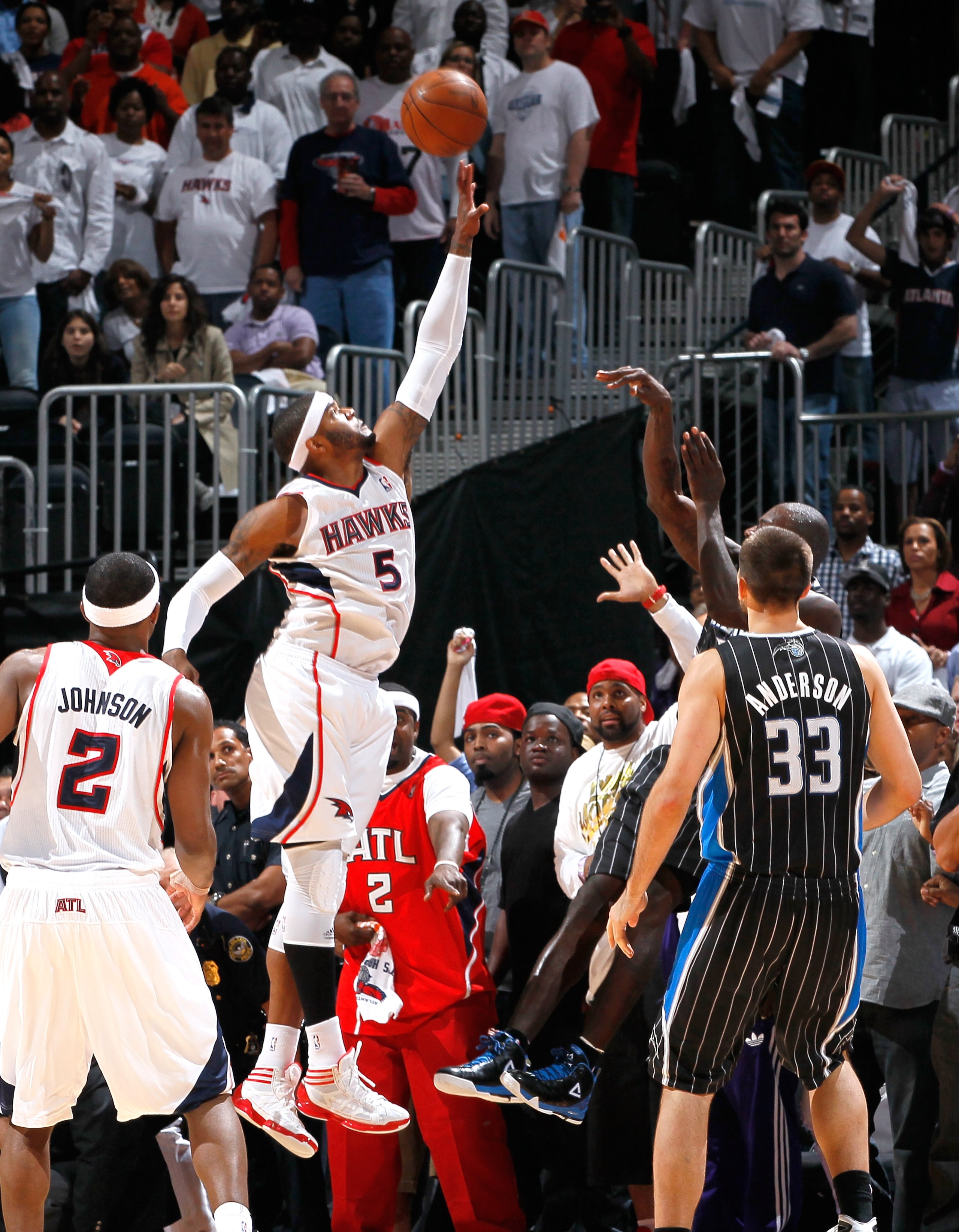 ATLANTA, GA - APRIL 28:  Josh Smith #5 of the Atlanta Hawks gets a hand on the final shot in regulation taken by Jason Richardson #23 of the Orlando Magic during Game Six of the Eastern Conference Quarterfinals in the 2011 NBA Playoffs at Philips Arena on