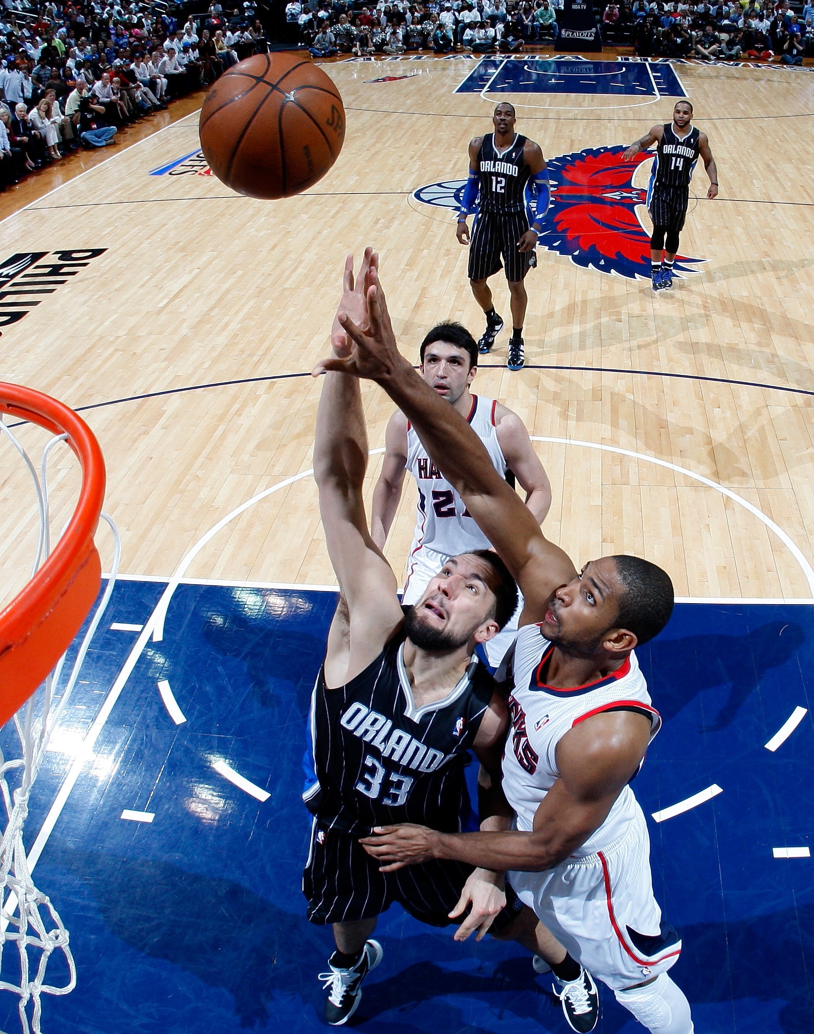 ATLANTA, GA - APRIL 28:  Ryan Anderson #33 of the Orlando Magic and Al Horford #15 of the Atlanta Hawks battle for a rebound during Game Six of the Eastern Conference Quarterfinals in the 2011 NBA Playoffs at Philips Arena on April 28, 2011 in Atlanta, Ge