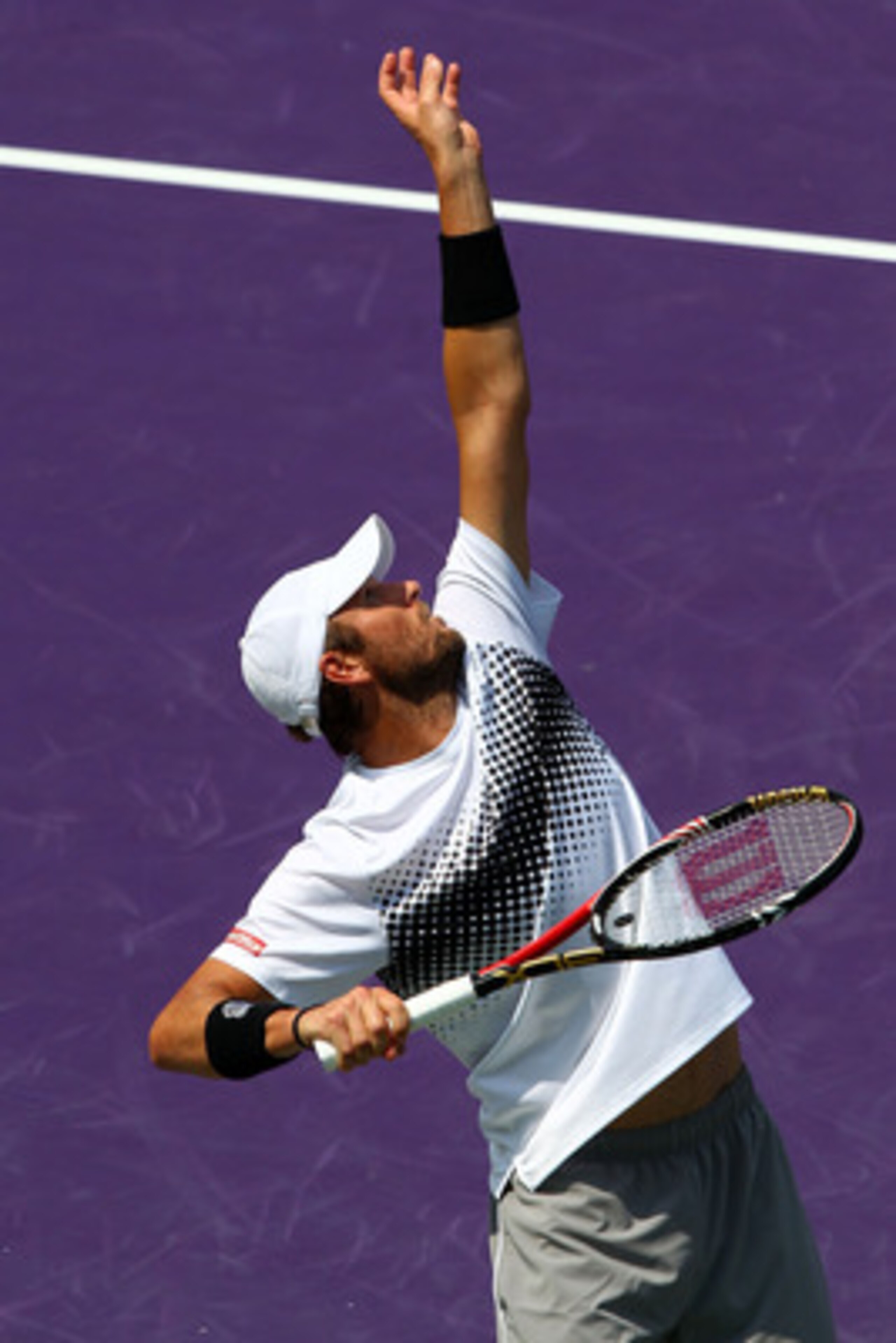 KEY BISCAYNE, FL - APRIL 01:  Mardy Fish serves against Novak Djokovic of Serbia during their semifinal match at the Sony Ericsson Open at Crandon Park Tennis Center on April 1, 2011 in Key Biscayne, Florida.  (Photo by Clive Brunskill/Getty Images)