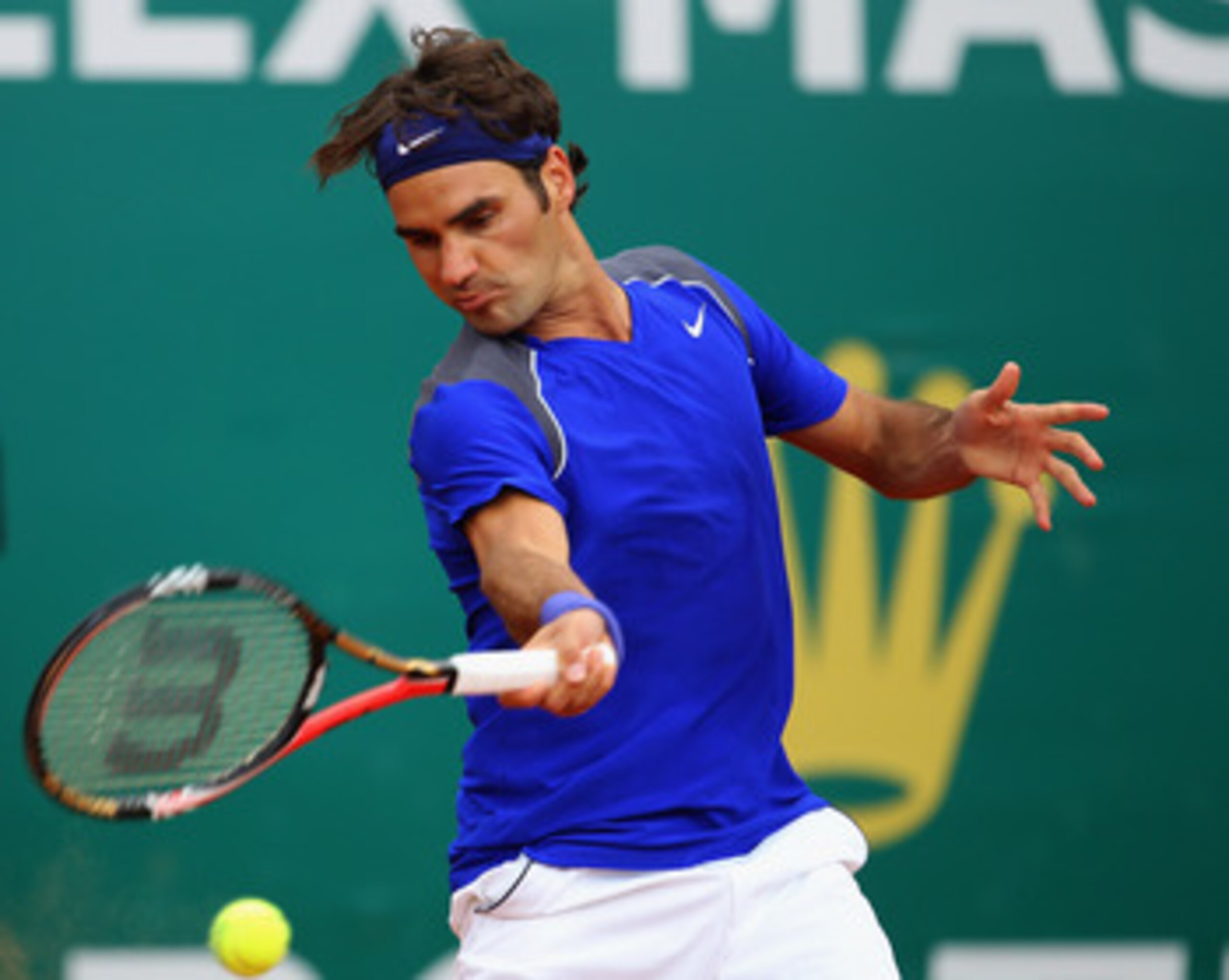 MONACO - APRIL 15:  Roger Federer of Switzerland plays a forehand in his match against Jurgen Melzer of Austria during Day Six of the ATP Masters Series Tennis at the Monte Carlo Country Club on April 15, 2011 in Monte Carlo, Monaco.  (Photo by Julian Fin
