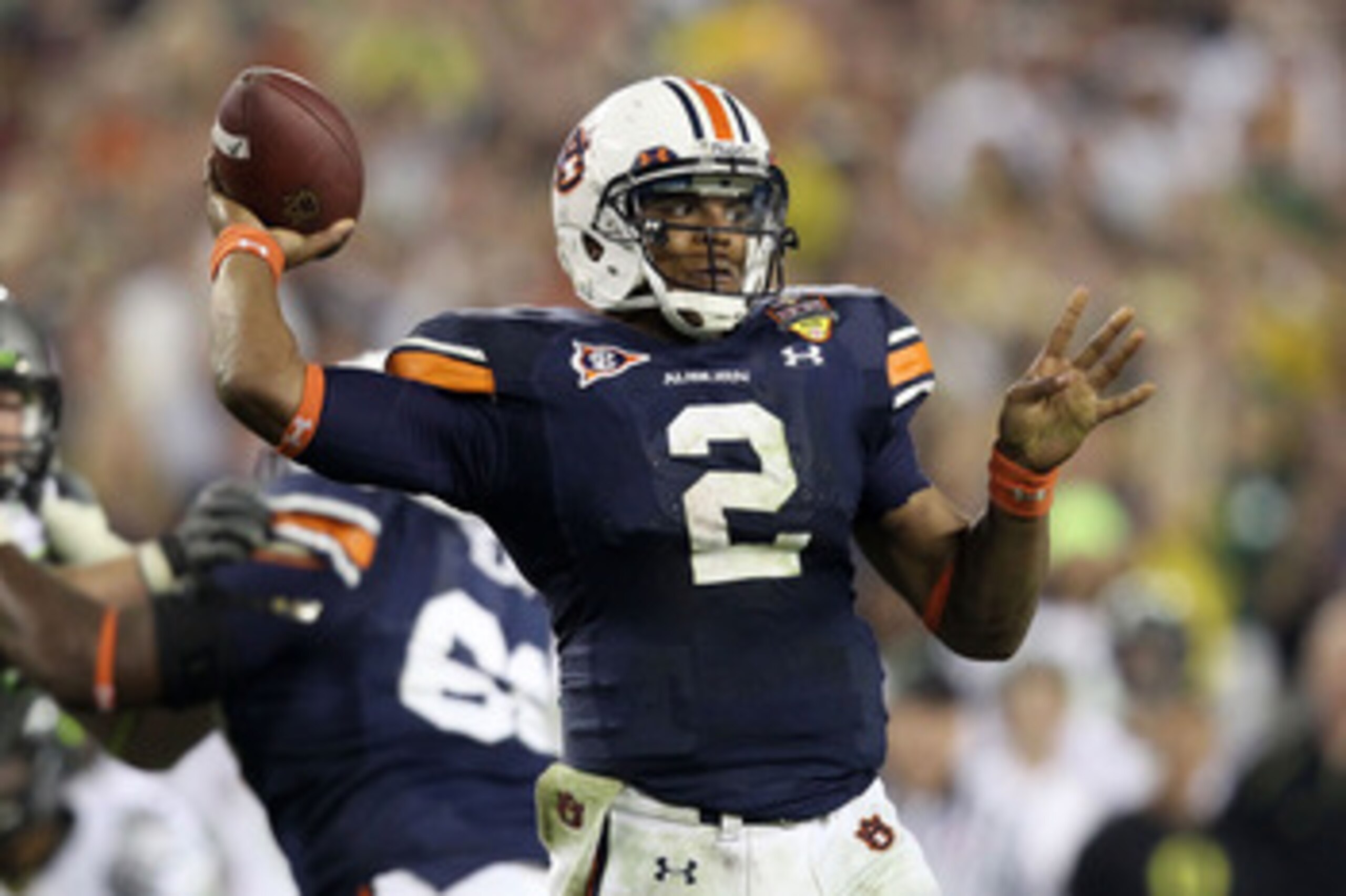 GLENDALE, AZ - JANUARY 10: Cameron Newton #2 of the Auburn Tigers scrambles against the Oregon Ducks during the Tostitos BCS National Championship Game at University of Phoenix Stadium on January 10, 2011 in Glendale, Arizona. (Photo by Christian Peters GLENDALE, AZ - JANUARY 10: Cameron Newton #2 of the Auburn Tigers scrambles against the Oregon Ducks during the Tostitos BCS National Championship Game at University of Phoenix Stadium on January 10, 2011 in Glendale, Arizona. (Photo by Christian Peters