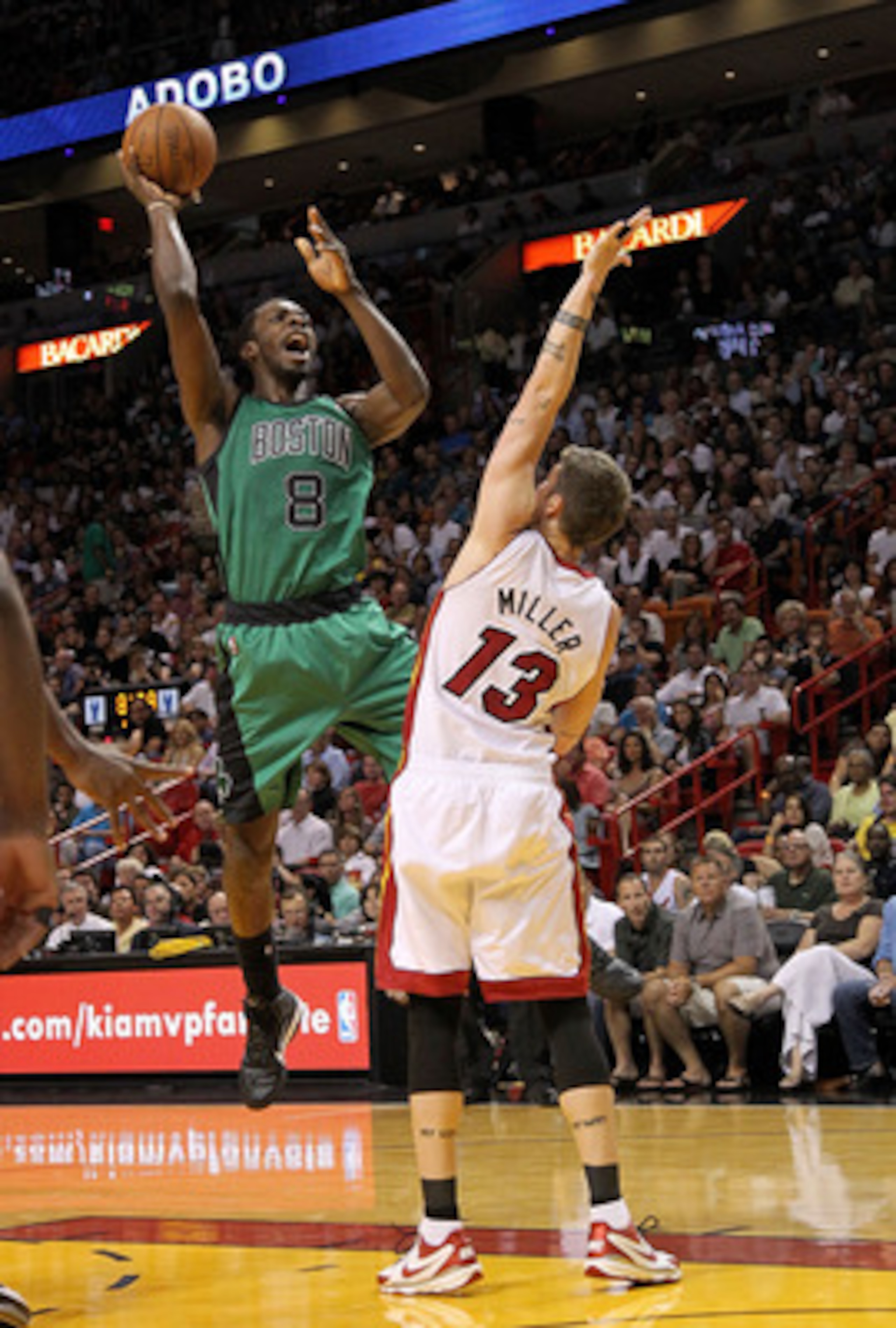 MIAMI, FL - APRIL 10:  Jeff Green #8 of the Boston Celtics shoots over Mike Miller #13 of the Miami Heat during a game at American Airlines Arena on April 10, 2011 in Miami, Florida. NOTE TO USER: User expressly acknowledges and agrees that, by downloadin