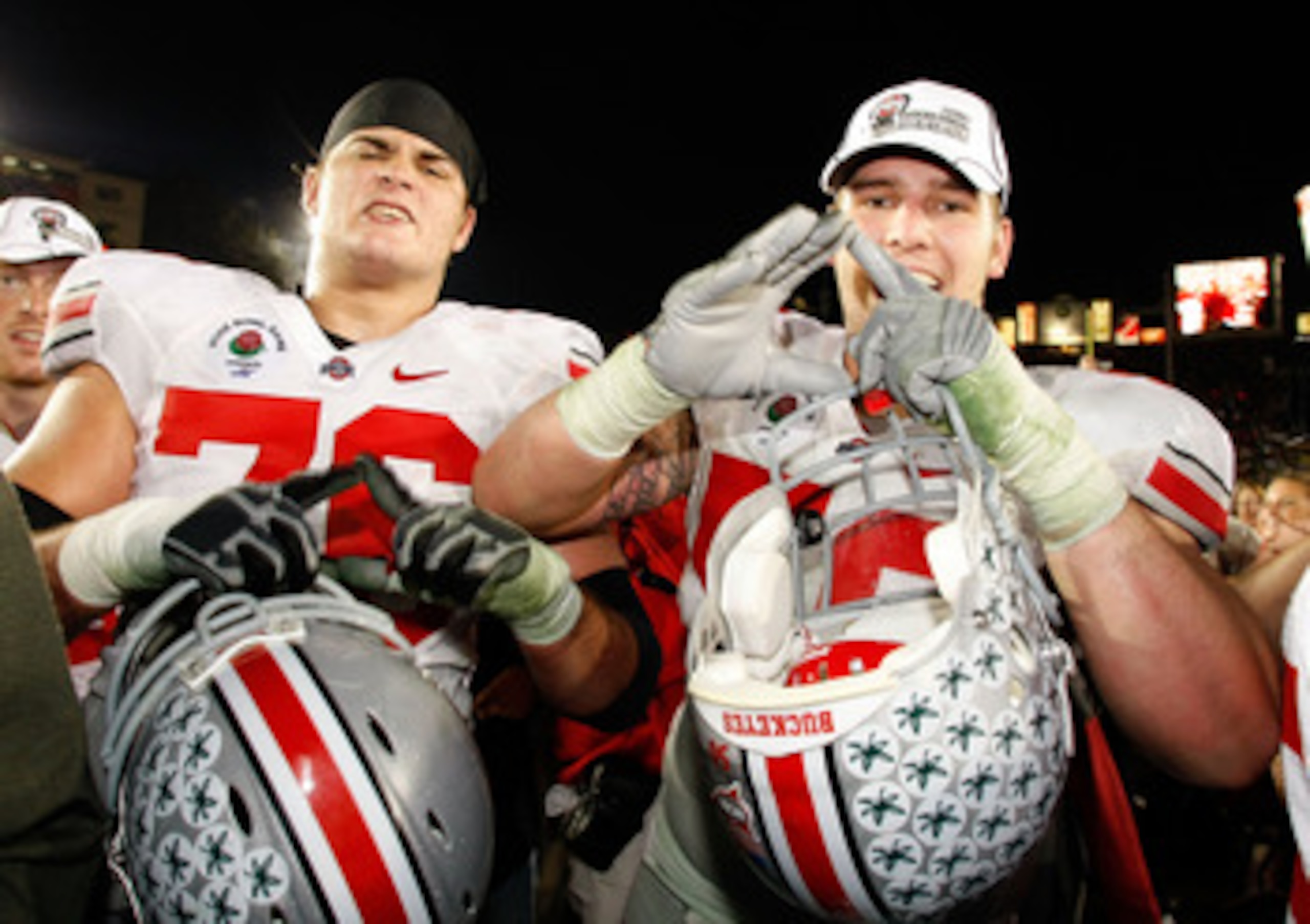 PASADENA, CA - JANUARY 01: (L-R) Linemen J.B. Shugarts #76 and Mike Brewster #50 of the Ohio State Buckeyes celebrate after their 26-17 win over the Oregon Ducks in the 96th Rose Bowl game on January 1, 2010 in Pasadena, California.  (Photo by Jeff Gross/