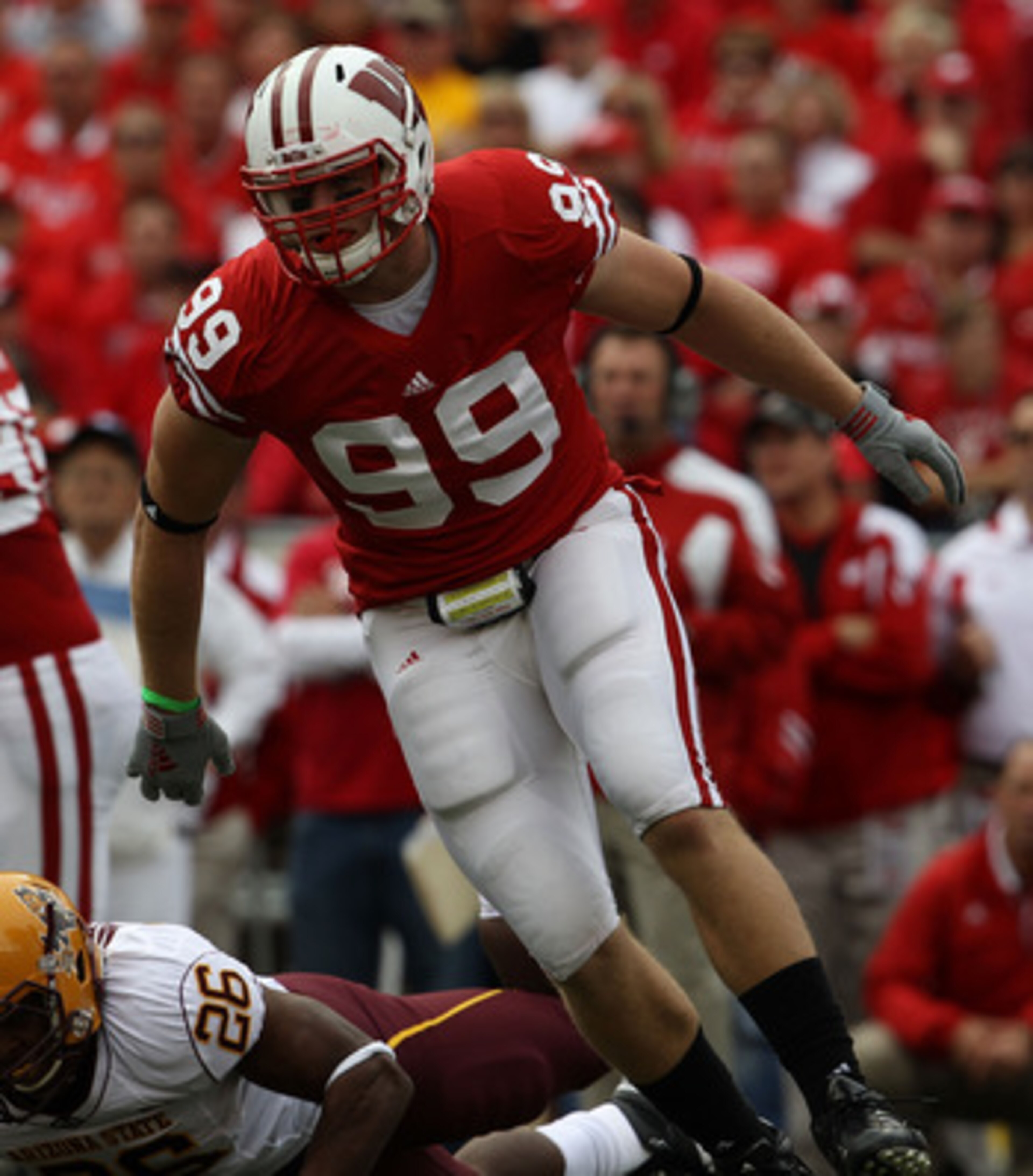 MADISON, WI - SEPTEMBER 18: J.J. Watt #99 of the Wisconsin Badgers rushes against the Arizona State Sun Devils at Camp Randall Stadium on September 18, 2010 in Madison, Wisconsin. Wisconsin defeated Arizona State 20-19. Wisconsin defeated Arizona State 20 MADISON, WI - SEPTEMBER 18: J.J. Watt #99 of the Wisconsin Badgers rushes against the Arizona State Sun Devils at Camp Randall Stadium on September 18, 2010 in Madison, Wisconsin. Wisconsin defeated Arizona State 20-19. Wisconsin defeated Arizona State 20