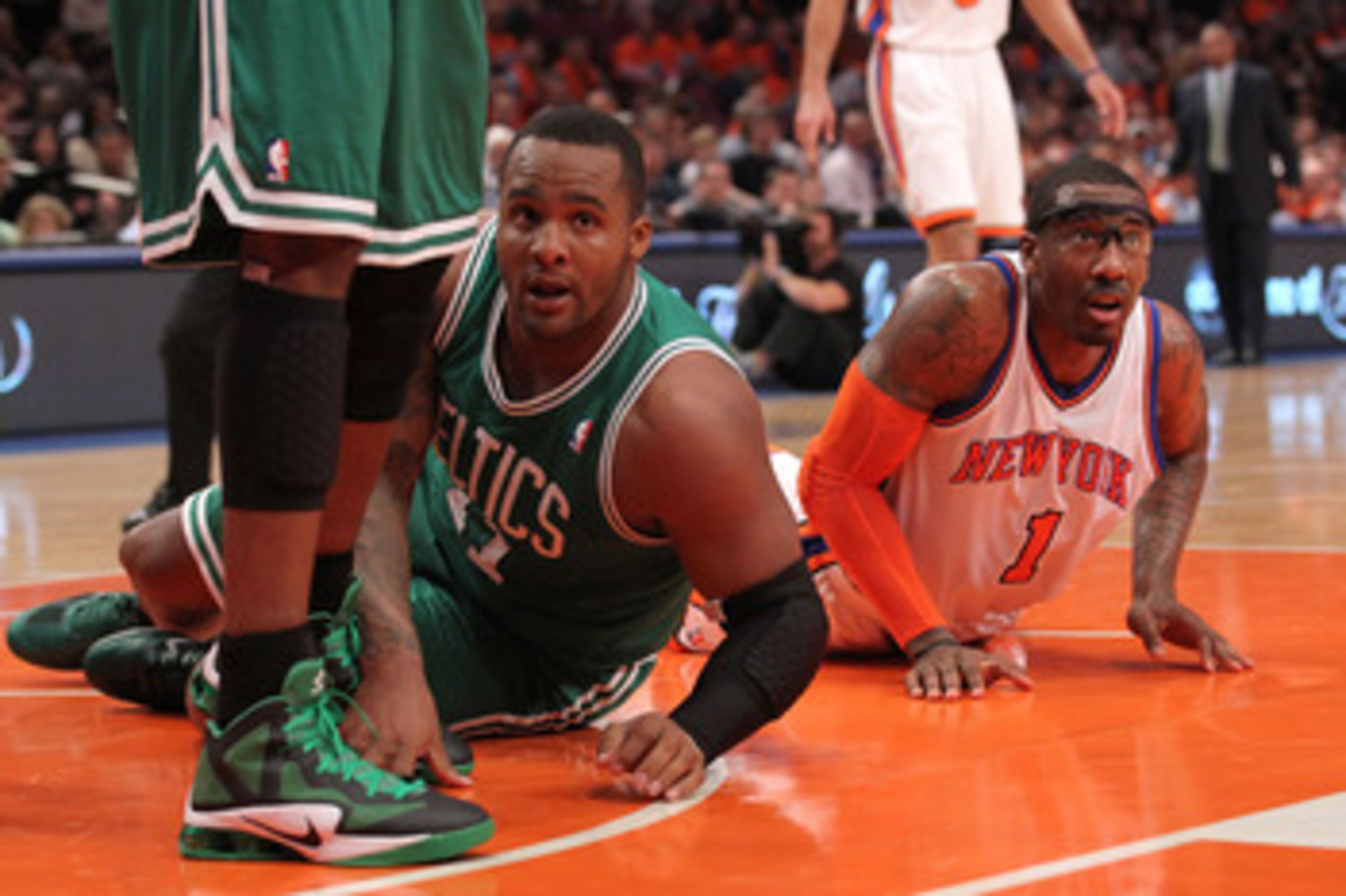 NEW YORK, NY - APRIL 24:  Glen Davis #11 of the Boston Celtics and Amar'e Stoudemire #1 of the New York Knicks look towards a referee forhis call in the first quarter of Game Four of the Eastern Conference Quarterfinals during the 2011 NBA Playoffs on Apr
