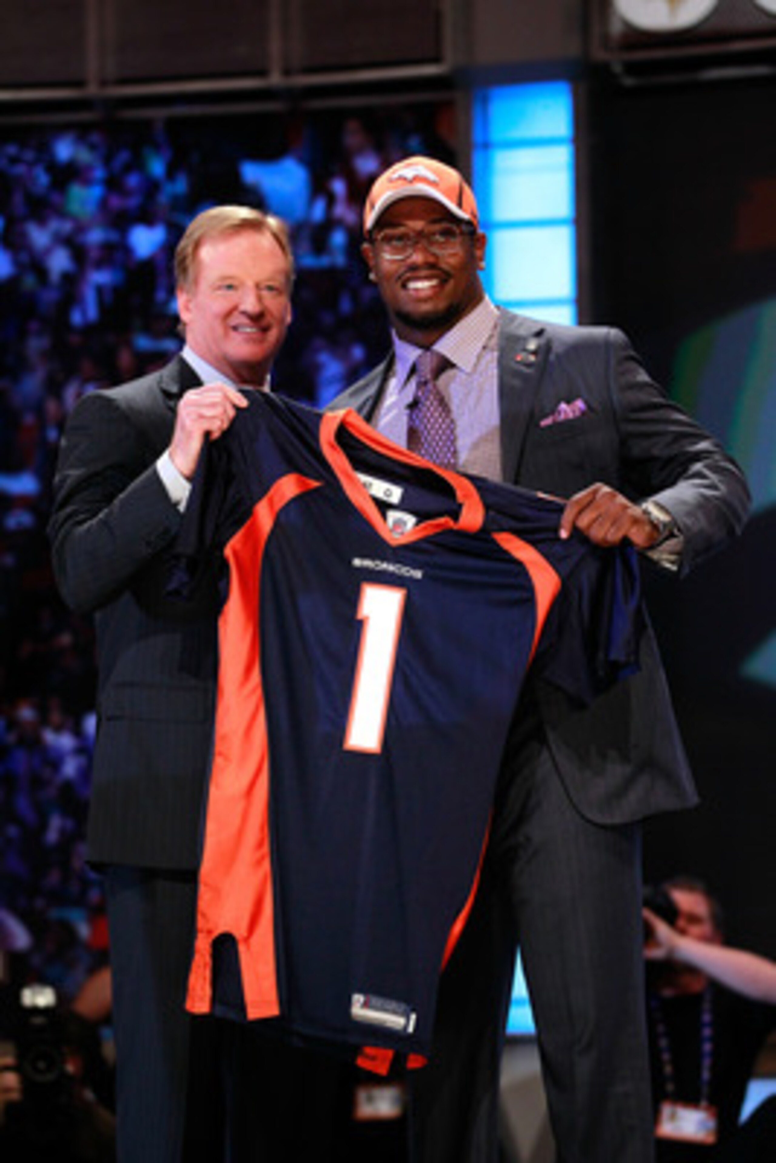 NEW YORK, NY - APRIL 28: NFL Commissioner Roger Goodell poses for a photo with Von Miller, #2 overall pick by the Denver Broncos, as he holds up a jersey on stage during the 2011 NFL Draft at Radio City Music Hall on April 28, 2011 in New York City. (Ph NEW YORK, NY - APRIL 28: NFL Commissioner Roger Goodell poses for a photo with Von Miller, #2 overall pick by the Denver Broncos, as he holds up a jersey on stage during the 2011 NFL Draft at Radio City Music Hall on April 28, 2011 in New York City. (Ph