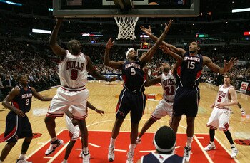 CHICAGO - NOVEMBER 27:  Josh Smith #5 and Al Horford #15 of the Atlanta Hawks reach for a rebound against Chris Duhon #21 and Luol Deng #9 of the Chicago Bulls at the United Center on November 27, 2007 in Chicago, Illinois.  NOTE TO USER: User expressly a