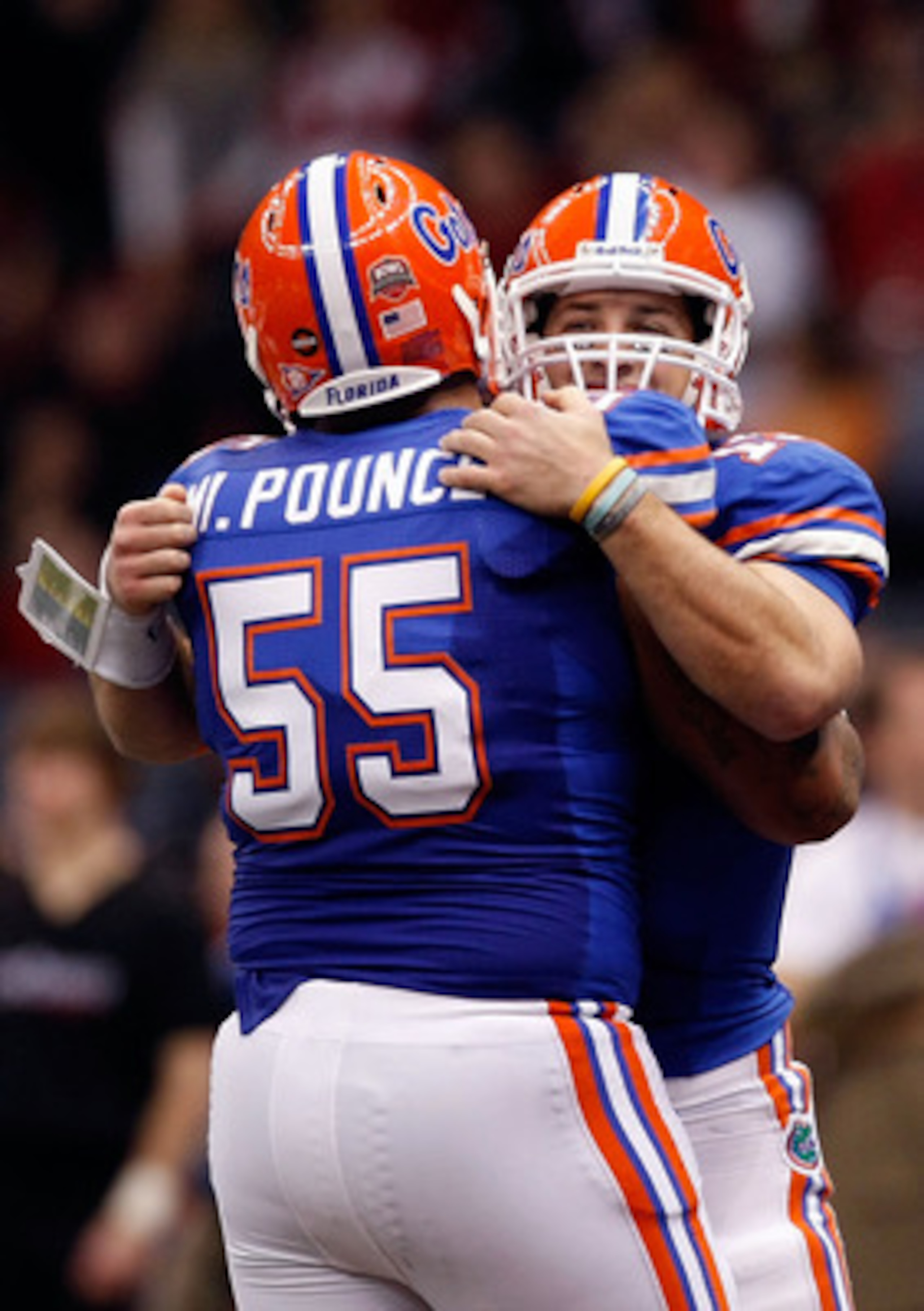 NEW ORLEANS - JANUARY 01:  Tim Tebow #15 of the Florida Gators hugs teammate Mike Pouncey #55 after scoring a touchdown against the Cincinnati Bearcats during the Allstate Sugar Bowl at the Louisana Superdome on January 1, 2010 in New Orleans, Louisiana. 