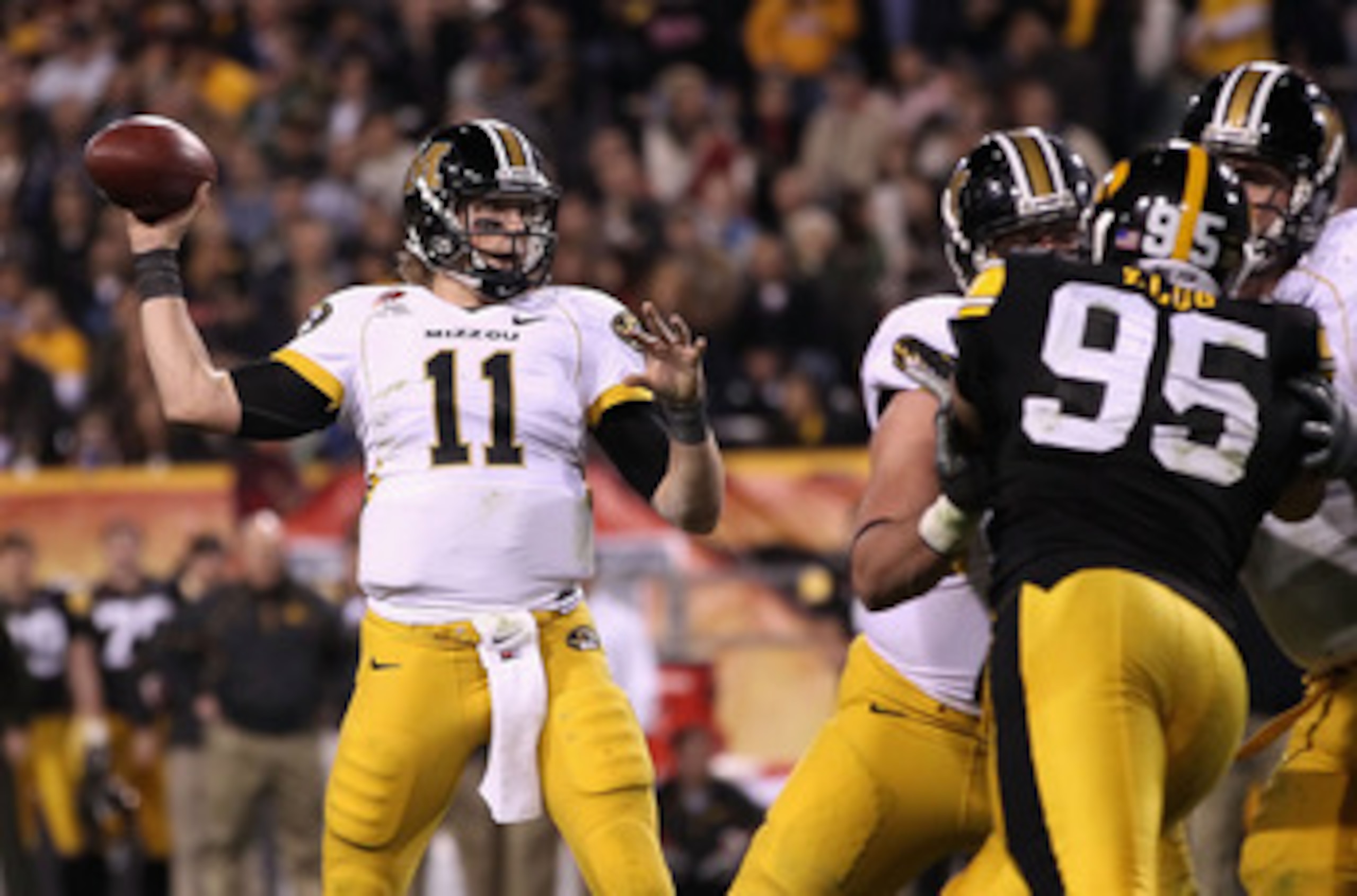 TEMPE, AZ - DECEMBER 28:  Quarterback Blaine Gabbert #11 of the Missouri Tigers drops back to pass during the Insight Bowl against the Iowa Hawkeyes  at Sun Devil Stadium on December 28, 2010 in Tempe, Arizona.  The Hawkeyes defeated the Tigers 27-24.  (P