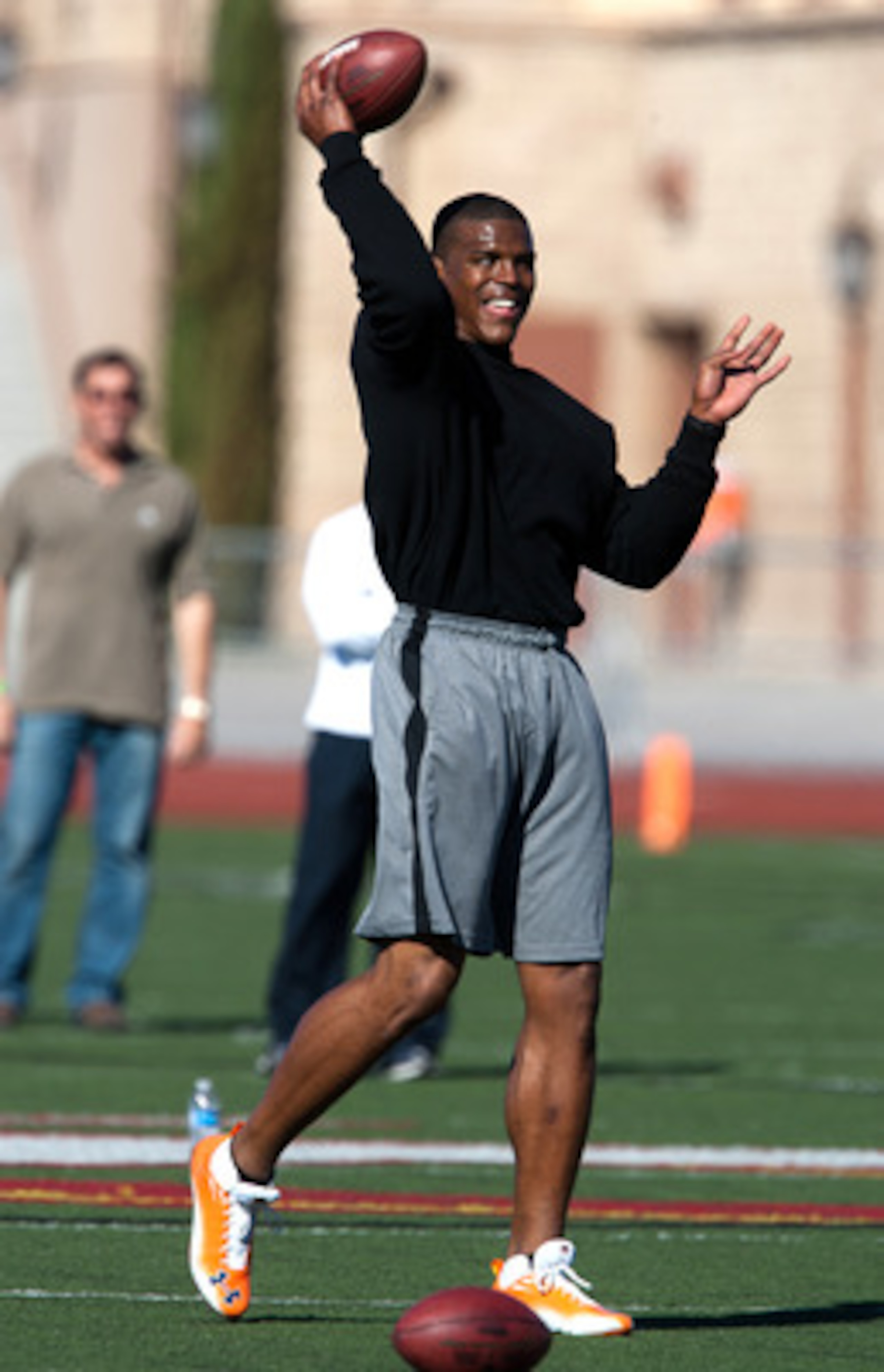 SAN DIEGO, CA - FEBRUARY 10: 2010 Heisman Trophy winning quarterback Cam Newton of Auburn throws the ball during his workout routine for the media at Cathedral High School's sports stadium on February 10, 2011 in San Diego, California. (Photo by Kent Horn