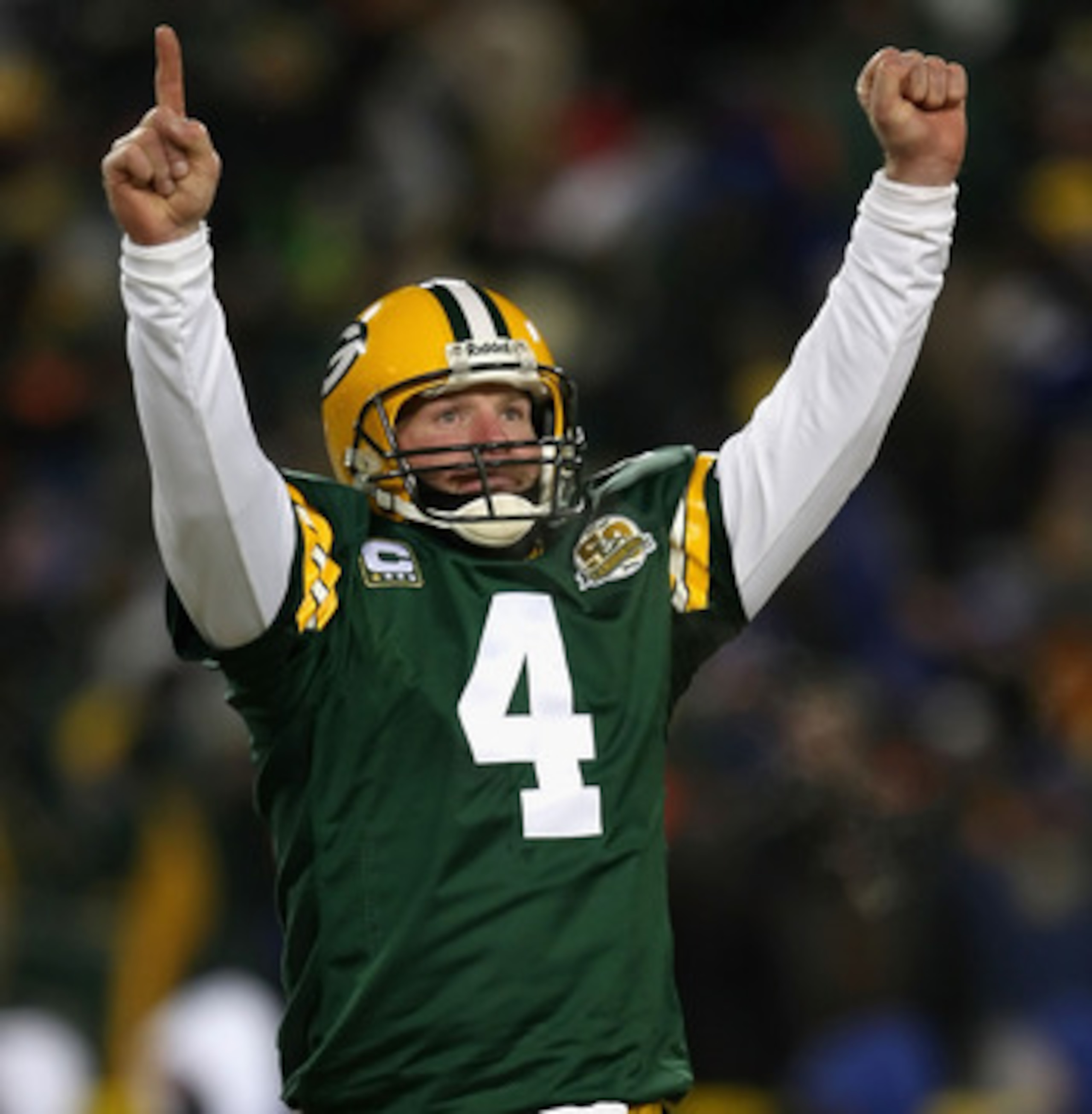 GREEN BAY, WI - JANUARY 20:  Quarterback Brett Favre #4 of the Green Bay Packers celebrates after throwing a 12 yard touchdown recption during the third quarter of the NFC championship game against the New York Giants on January 20, 2008 at Lambeau Field