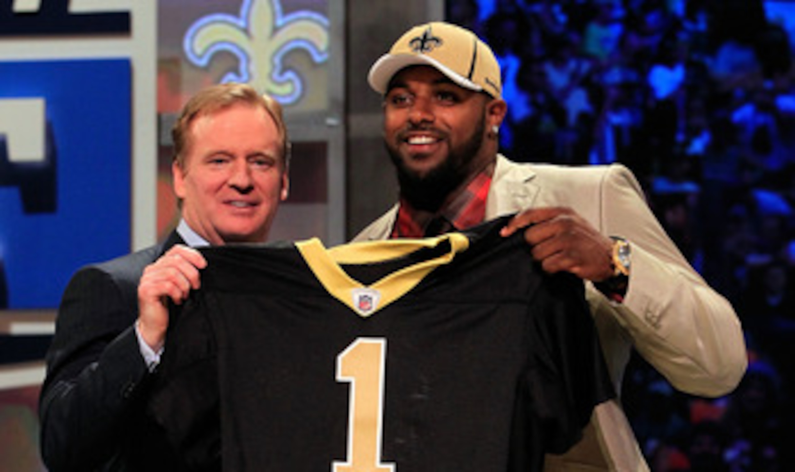 NEW YORK, NY - APRIL 28: NFL Commissioner Roger Goodell (L) poses for a photo with Cameron Jordan, #24 overall pick by the New Orleans Saints, holds up a jersey on stage during the 2011 NFL Draft at Radio City Music Hall on April 28, 2011 in New York Cit NEW YORK, NY - APRIL 28: NFL Commissioner Roger Goodell (L) poses for a photo with Cameron Jordan, #24 overall pick by the New Orleans Saints, holds up a jersey on stage during the 2011 NFL Draft at Radio City Music Hall on April 28, 2011 in New York Cit