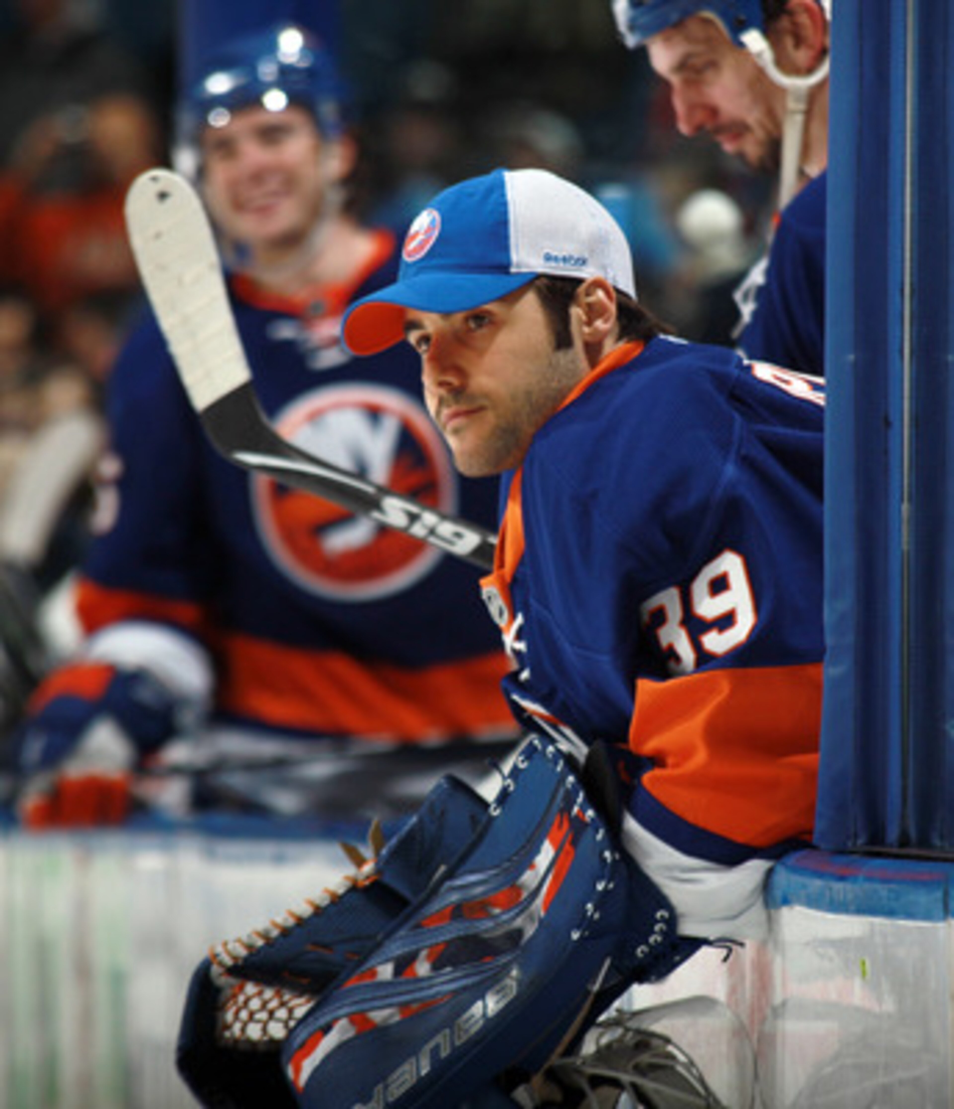 UNIONDALE, NY - MARCH 31: Rick DiPietro #39 of the New York Islanders watches the game against the New York Rangers from the bench at the Nassau Coliseum on March 31, 2011 in Uniondale, New York.  (Photo by Bruce Bennett/Getty Images)
