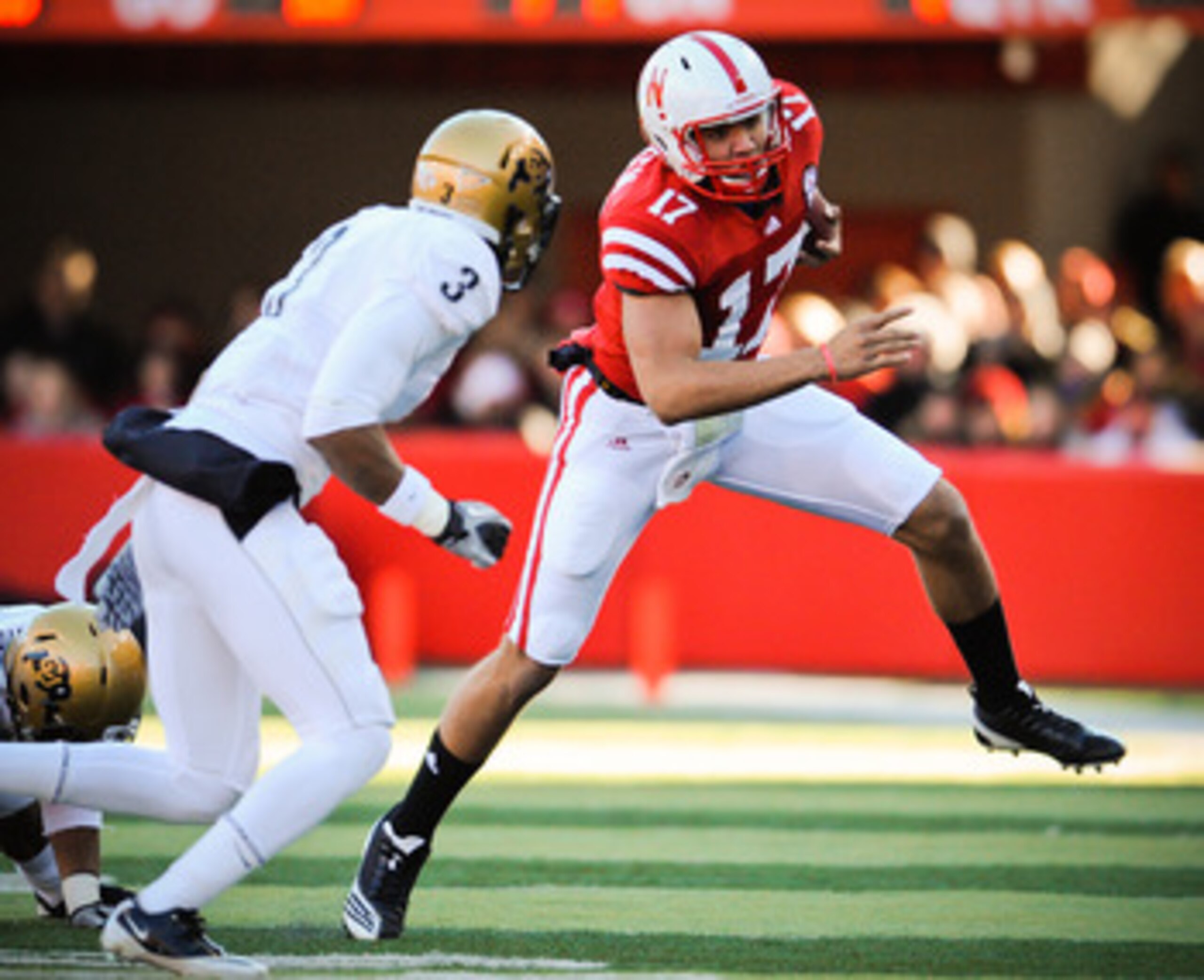 LINCOLN, NE - NOVEMBER 26: Cody Green #17 of the Nebraska Cornhuskers slips past Jimmy Smith #3 of the Colorado Buffaloes during their game at Memorial Stadium on November 26, 2010 in Lincoln, Nebraska. Nebraska defeated Colorado 45-17 (Photo by Eric Fran LINCOLN, NE - NOVEMBER 26: Cody Green #17 of the Nebraska Cornhuskers slips past Jimmy Smith #3 of the Colorado Buffaloes during their game at Memorial Stadium on November 26, 2010 in Lincoln, Nebraska. Nebraska defeated Colorado 45-17 (Photo by Eric Fran