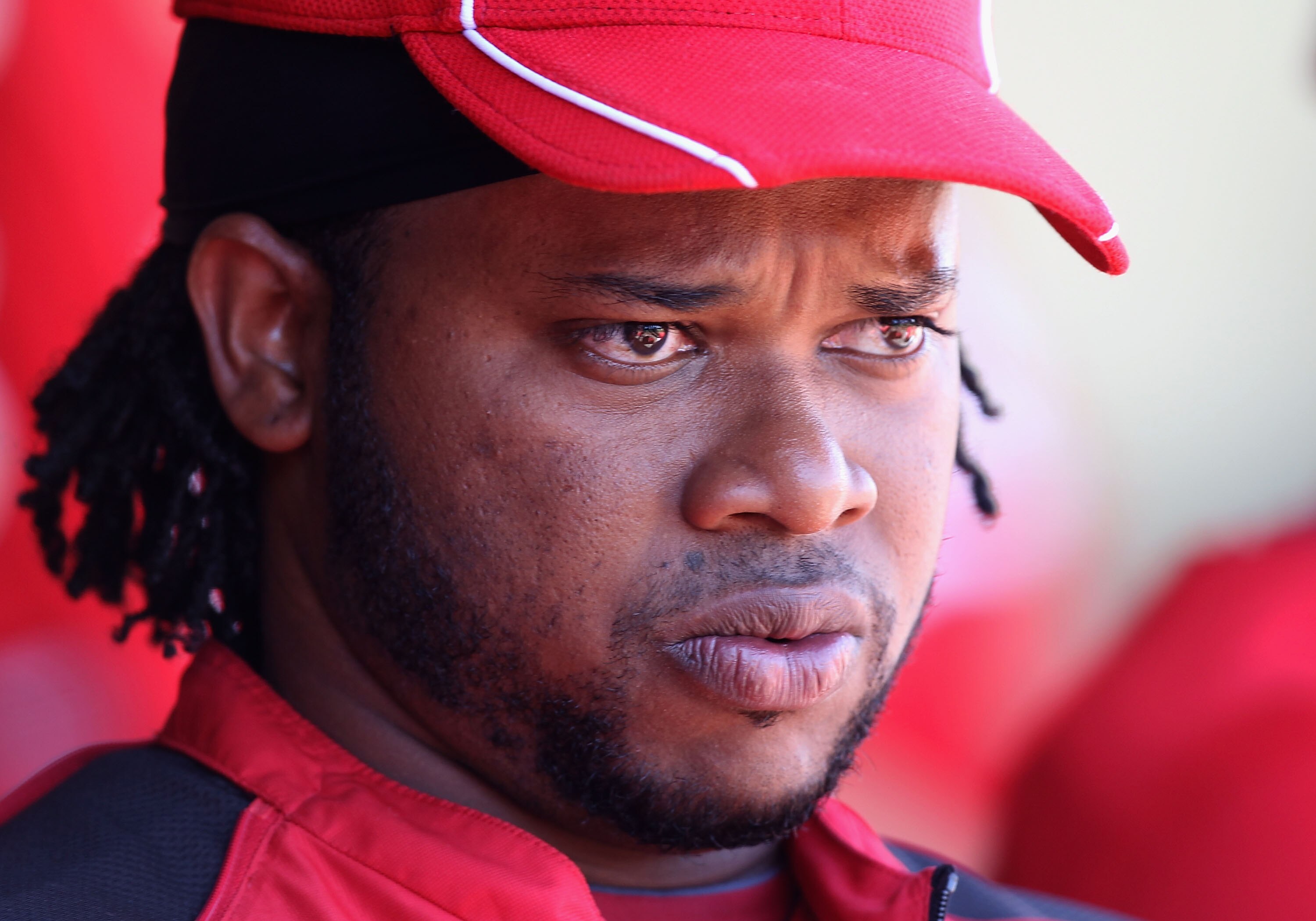 SURPRISE, AZ - MARCH 11:  Starting pitcher Johnny Cueto #47 of the Cincinnati Reds watches from the dugout during the spring training game against the Texas Rangers at Surprise Stadium on March 11, 2011 in Surprise, Arizona.  (Photo by Christian Petersen/