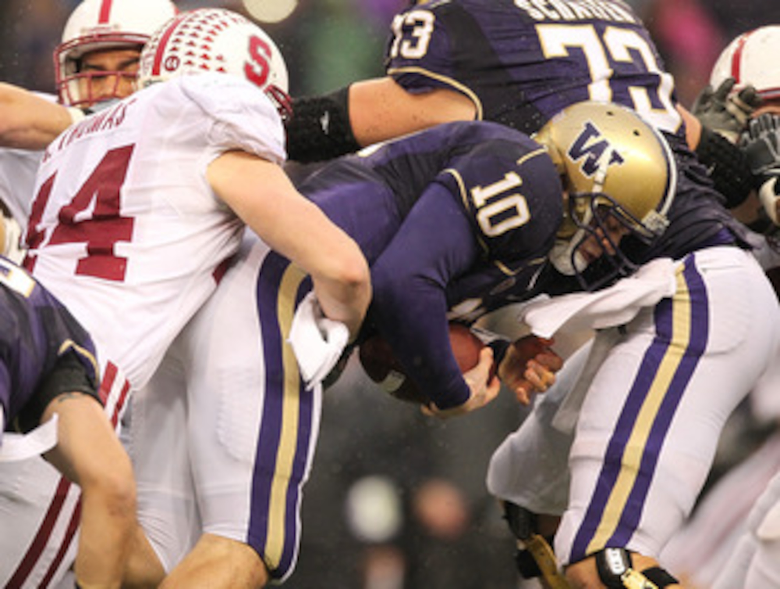 SEATTLE - OCTOBER 30: Quarterback Jake Locker #10 of the Washington Huskies is tackled by Chase Thomas #44 of the Stanford Cardinal on October 30, 2010 at Husky Stadium in Seattle, Washington. (Photo by Otto Greule Jr/Getty Images) SEATTLE - OCTOBER 30: Quarterback Jake Locker #10 of the Washington Huskies is tackled by Chase Thomas #44 of the Stanford Cardinal on October 30, 2010 at Husky Stadium in Seattle, Washington. (Photo by Otto Greule Jr/Getty Images)