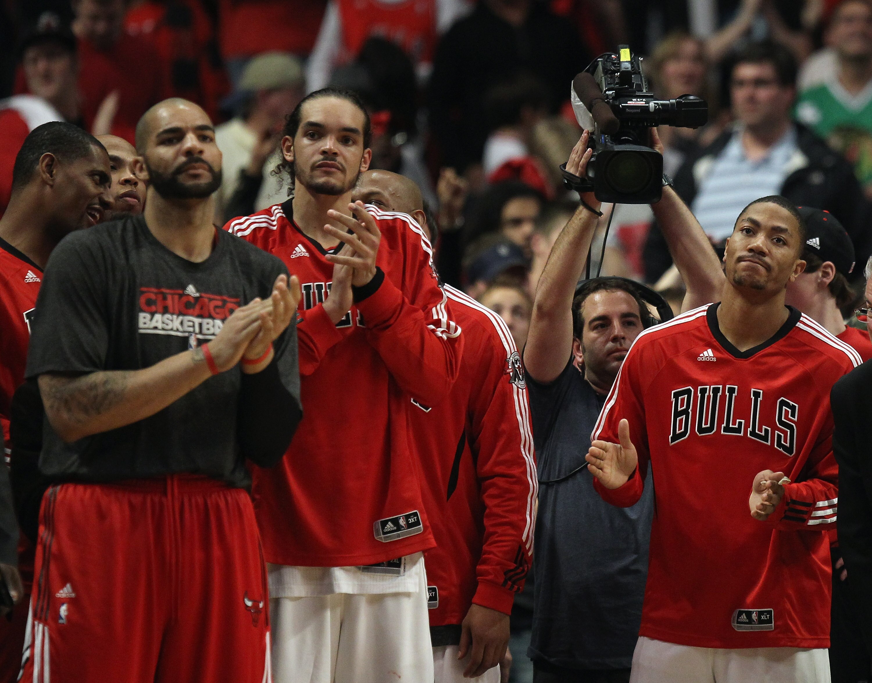 CHICAGO, IL - APRIL 26: (L-R) Carlos Boozer #5, Joakim Noah #13 and Derrick Rose #1 of the Chicago Bulls celebrate a win over the Indiana Pacers in Game Five of the Eastern Conference Quarterfinals in the 2011 NBA Playoffs at the United Center on April 26