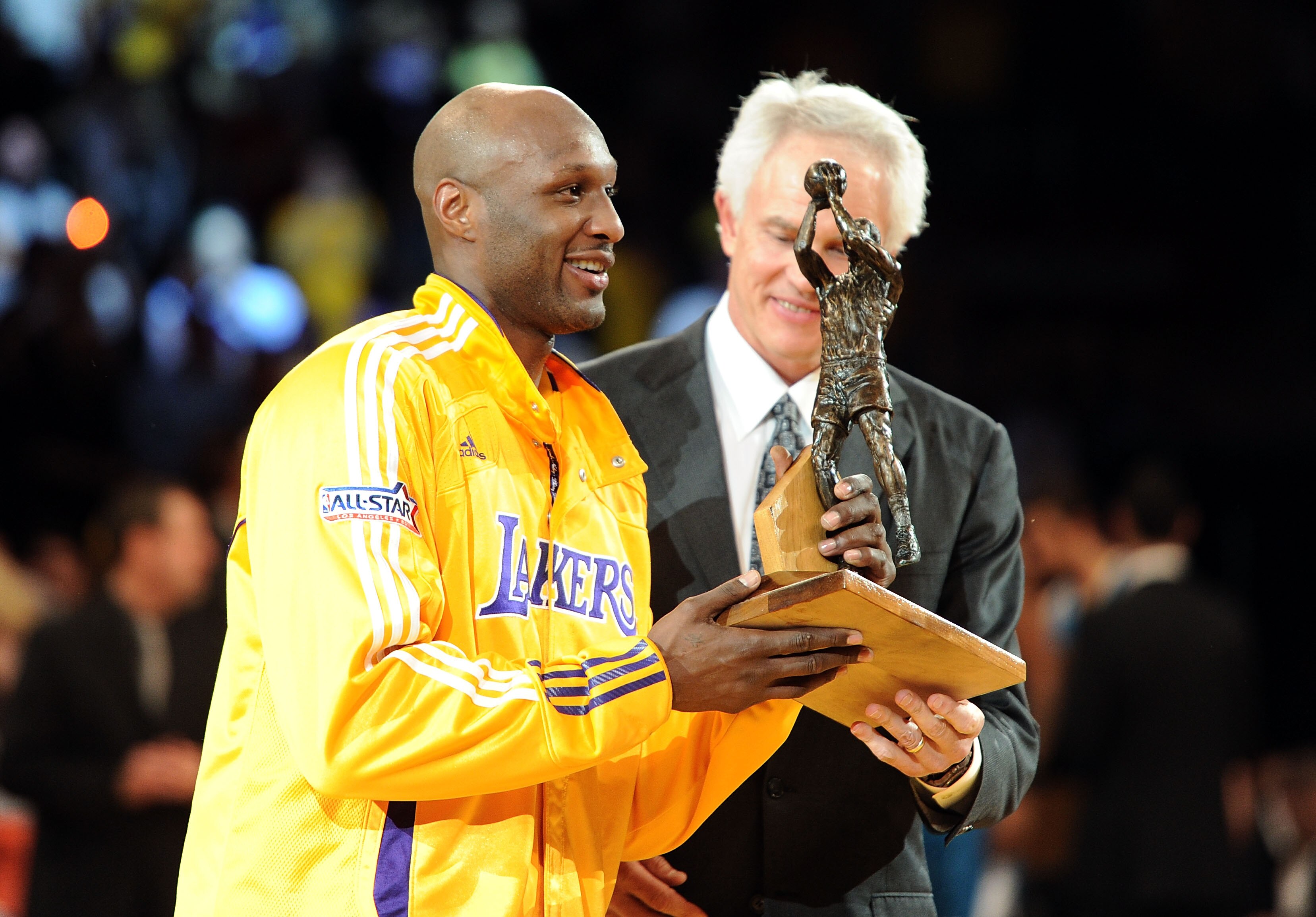 LOS ANGELES, CA - APRIL 20:  Lamar Odom #7 of the Los Angeles Lakers receives the Kia Six Man of the Year Award from Lakers General Manager Mitch Kupchak before Game Two of the Western Conference Quarterfinals in the 2011 NBA Playoffs against the New Orle