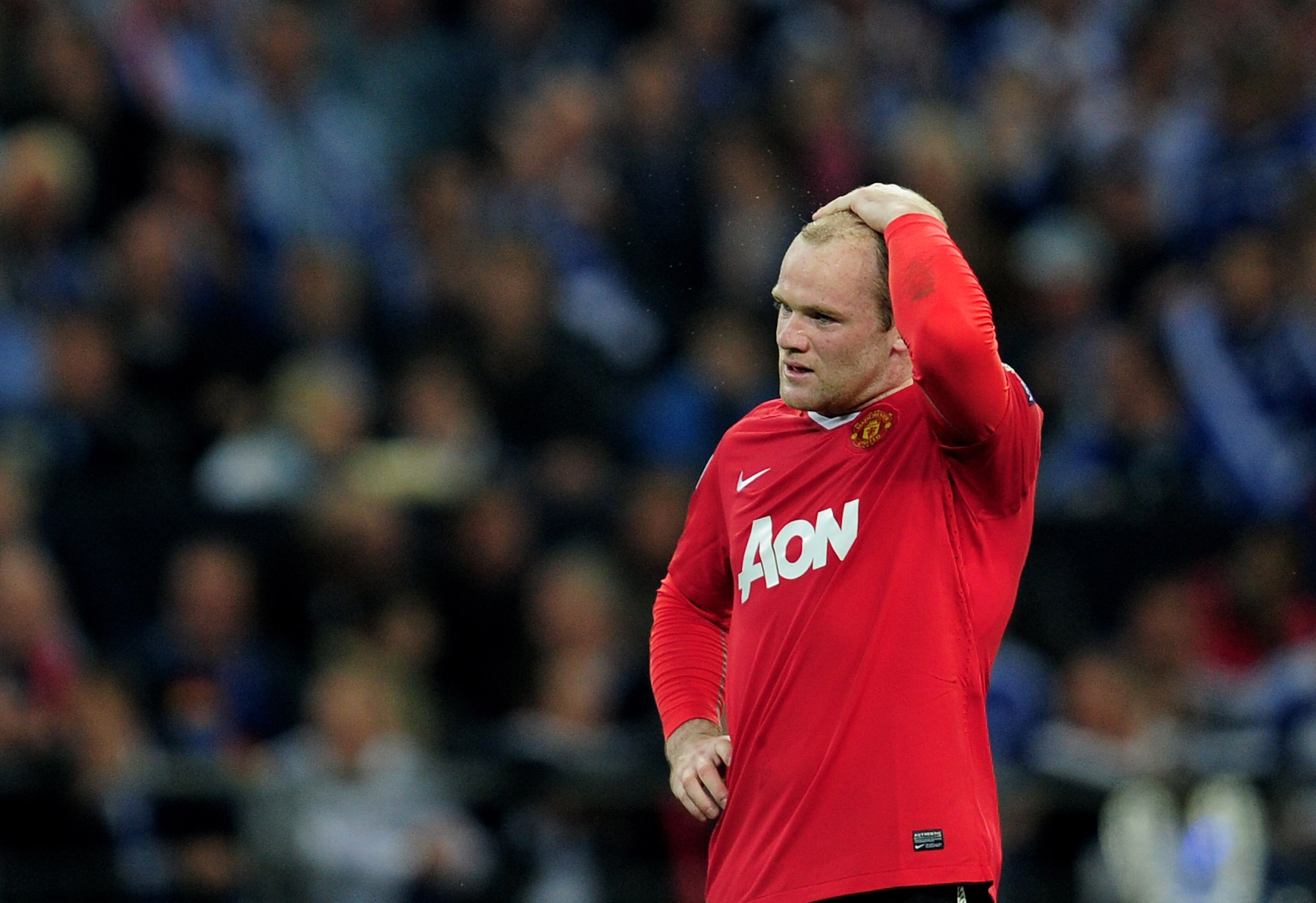 GELSENKIRCHEN, GERMANY - APRIL 26:  Wayne Rooney of Manchester United reacts during the UEFA Champions League Semi Final first leg match between FC Schalke 04 and Manchester United at Veltins Arena on April 26, 2011 in Gelsenkirchen, Germany.  (Photo by J