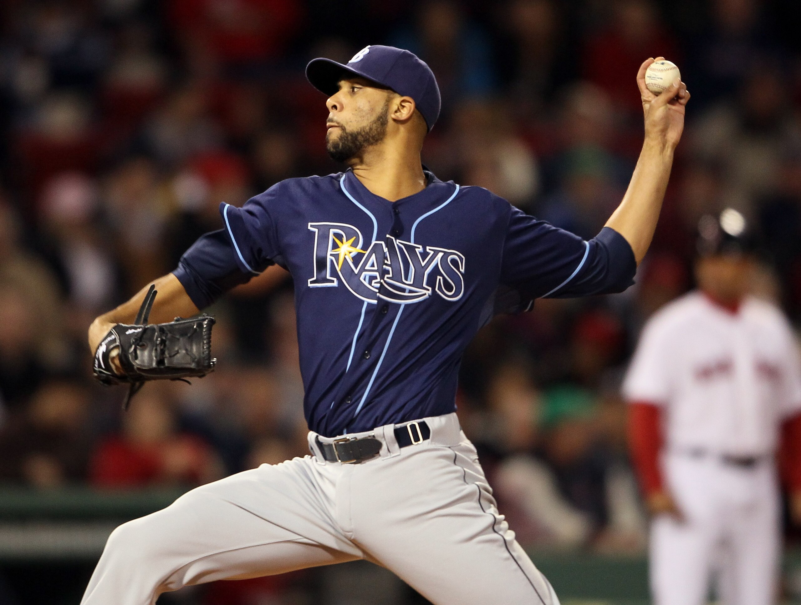 BOSTON, MA - APRIL 12:  David Price #14 of the Tampa Bay Rays delivers a pitch in the first inning against the Boston Red Sox on April 12, 2011 at Fenway Park in Boston, Massachusetts.  (Photo by Elsa/Getty Images)