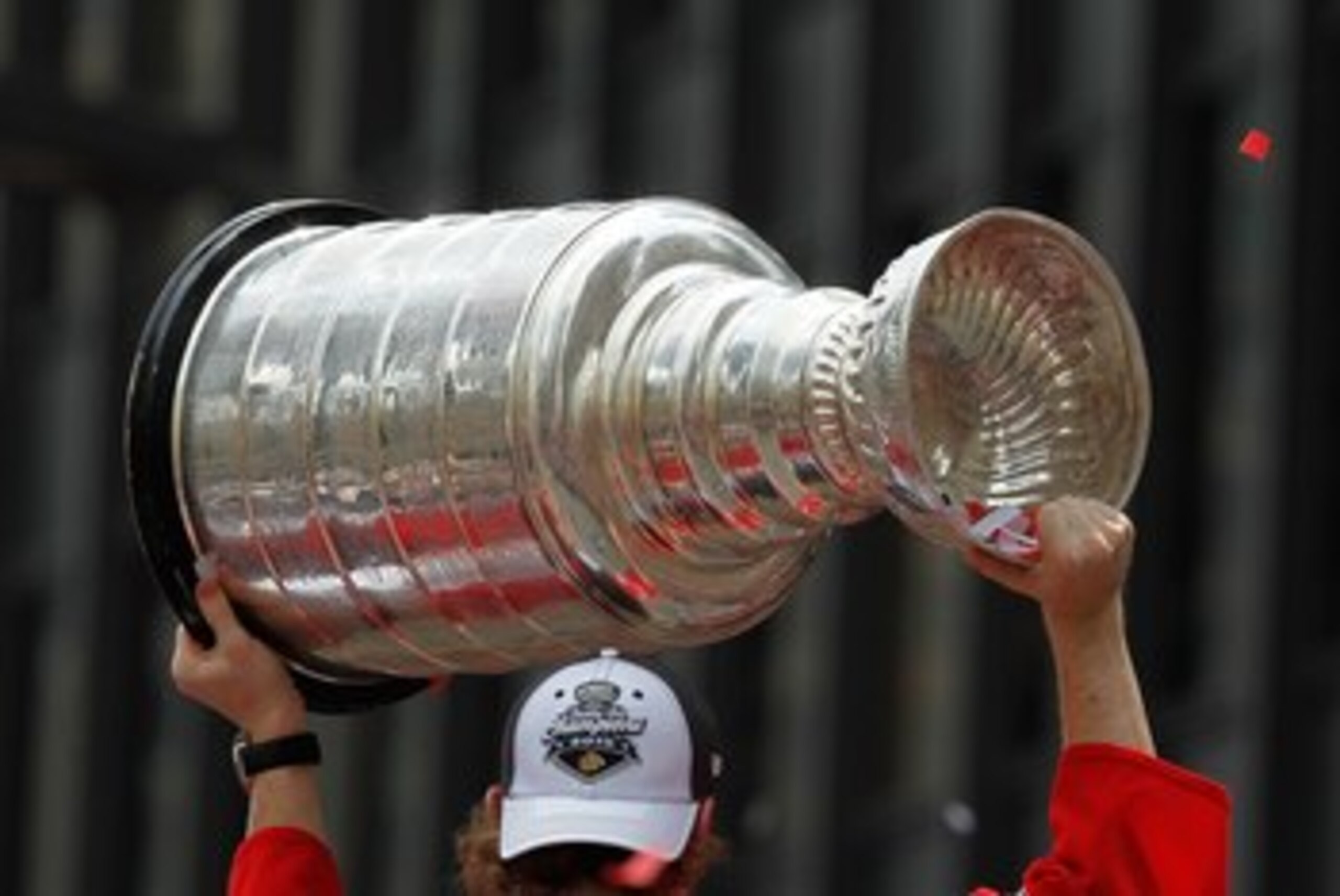 CHICAGO - JUNE 11: Patrick Kane #88 hoists the cup during the Chicago Blackhawks Stanley Cup victory parade and rally on June 11, 2010 in Chicago, Illinois. (Photo by Jonathan Daniel/Getty Images)