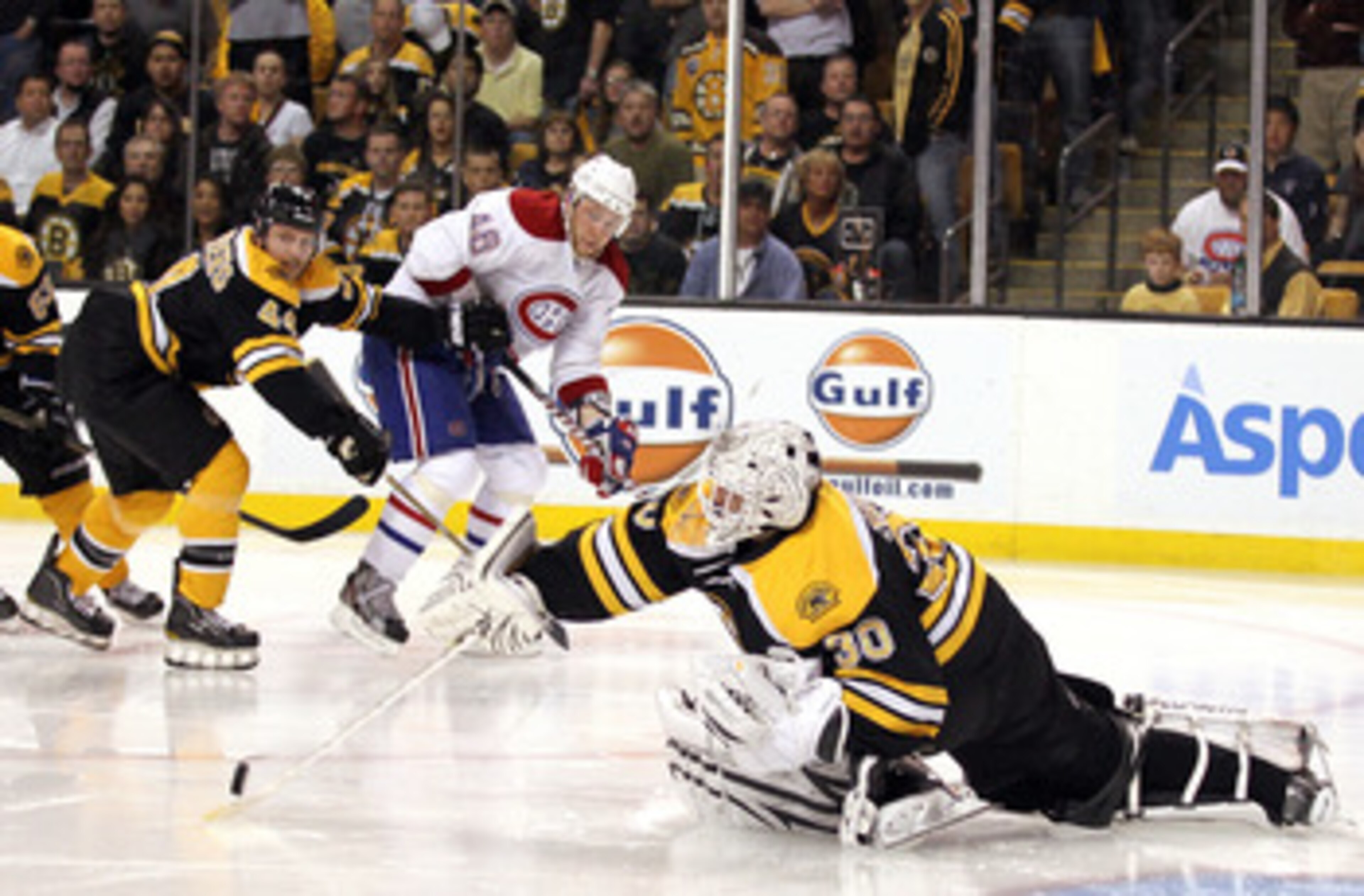 BOSTON, MA - APRIL 27:  Goalie Tim Thomas #30 of the Boston Bruins makes the save against Andrei Kostitsyn #46 of the Montreal Canadiens in Game Seven of the Eastern Conference Quarterfinals during the 2011 NHL Stanley Cup Playoffs at TD Garden on April 2