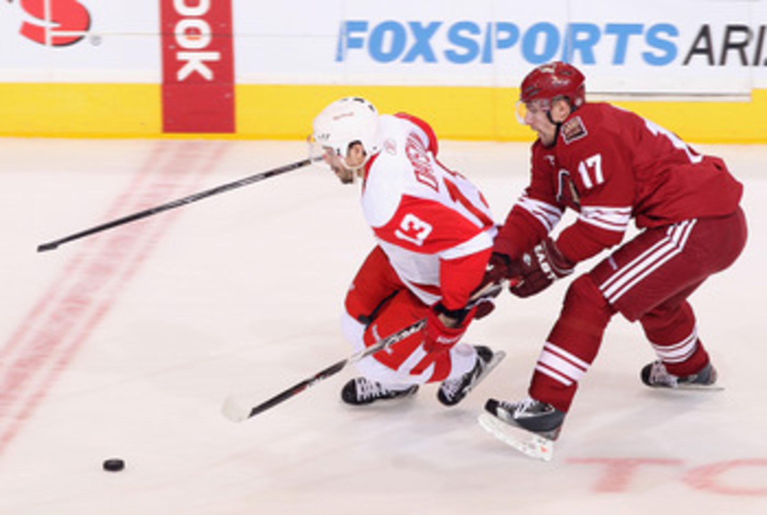 GLENDALE, AZ - APRIL 20:  Pavel Datsyuk #13 of the Detroit Red Wings skates with the puck past Radim Vrbata #17 of the Phoenix Coyotes in Game Four of the Western Conference Quarterfinals during the 2011 NHL Stanley Cup Playoffs at Jobing.com Arena on Apr