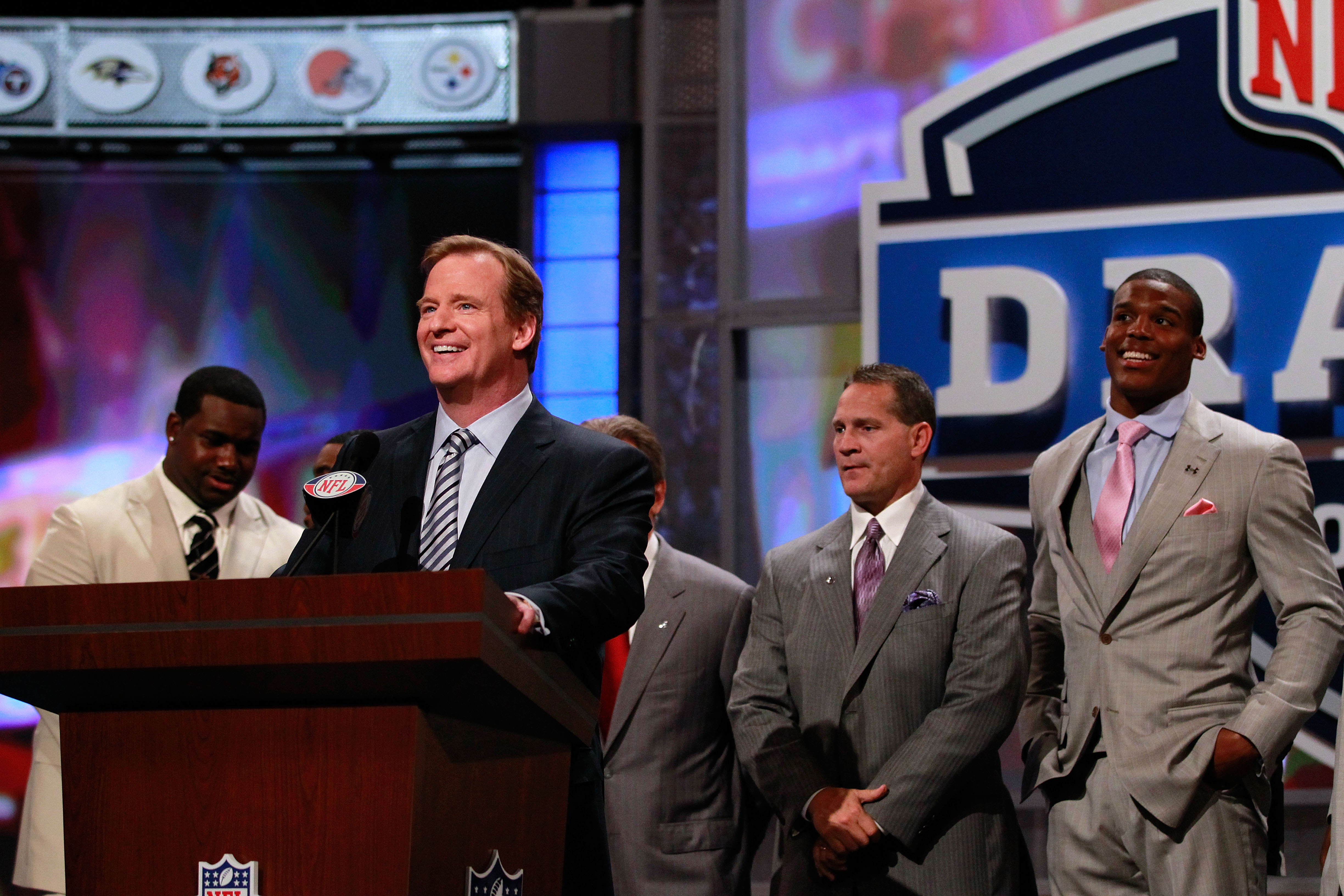 NEW YORK, NY - APRIL 28:  NFL Commissioner Roger Goodell speaks at the podium as draft prospect Cam Newton looks on (R) during the 2011 NFL Draft at Radio City Music Hall on April 28, 2011 in New York City.  (Photo by Chris Trotman/Getty Images)