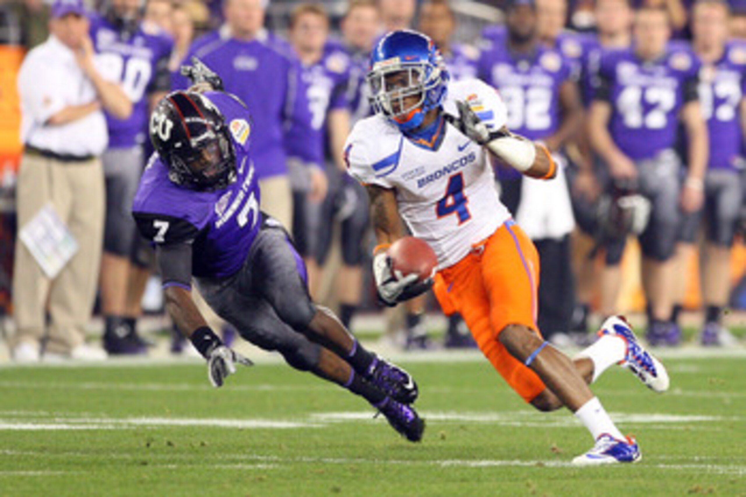 GLENDALE, AZ - JANUARY 04: Titus Young #4 of the Boise State Broncos runs after a catch past Greg McCoy #7 of the TCU Horned Frogs in the first half during the Tostitos Fiesta Bowl at the Universtity of Phoenix Stadium on January 4, 2010 in Glendale, Ari GLENDALE, AZ - JANUARY 04: Titus Young #4 of the Boise State Broncos runs after a catch past Greg McCoy #7 of the TCU Horned Frogs in the first half during the Tostitos Fiesta Bowl at the Universtity of Phoenix Stadium on January 4, 2010 in Glendale, Ari