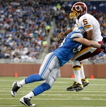DETROIT - OCTOBER 31: Kyle Vanden Bosch #93 of the Detroit Lions hits Donovan McNabb #5 of the Washington Redskins during the first quarter of the game at Ford Field on October 31, 2010 in Detroit, Michigan. (Photo by Leon Halip/Getty Images)