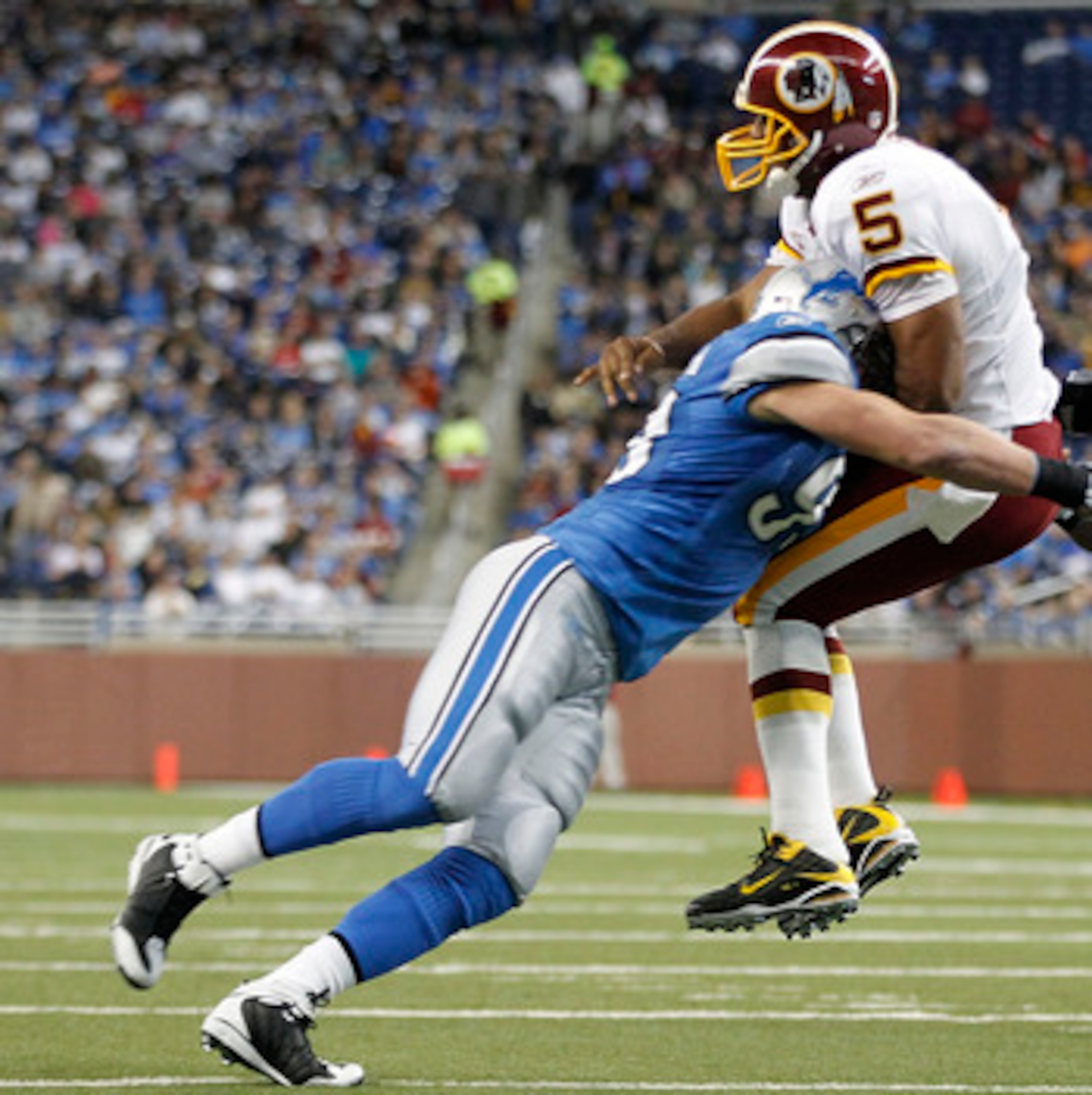 DETROIT - OCTOBER 31: Kyle Vanden Bosch #93 of the Detroit Lions hits Donovan McNabb #5 of the Washington Redskins during the first quarter of the game at Ford Field on October 31, 2010 in Detroit, Michigan. (Photo by Leon Halip/Getty Images) DETROIT - OCTOBER 31: Kyle Vanden Bosch #93 of the Detroit Lions hits Donovan McNabb #5 of the Washington Redskins during the first quarter of the game at Ford Field on October 31, 2010 in Detroit, Michigan. (Photo by Leon Halip/Getty Images)