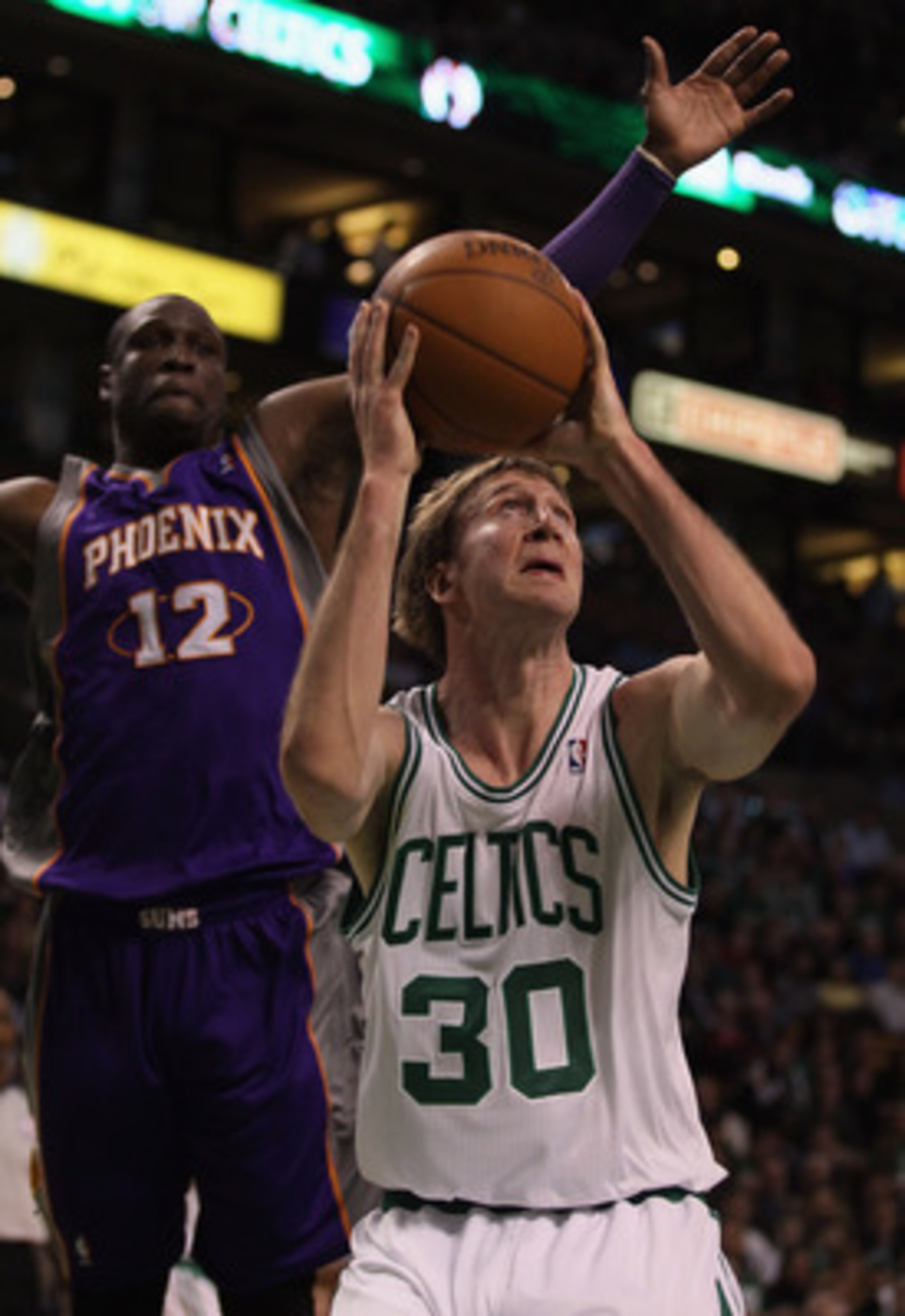 BOSTON, MA - MARCH 02: Troy Murphy #30 of the Boston Celtics takes a shot as Mickael Pietrus #12 of the Phoenix Suns defends on March 2, 2011 at the TD Garden in Boston, Massachusetts. NOTE TO USER: User expressly acknowledges and agrees that, by downlo BOSTON, MA - MARCH 02: Troy Murphy #30 of the Boston Celtics takes a shot as Mickael Pietrus #12 of the Phoenix Suns defends on March 2, 2011 at the TD Garden in Boston, Massachusetts. NOTE TO USER: User expressly acknowledges and agrees that, by downlo