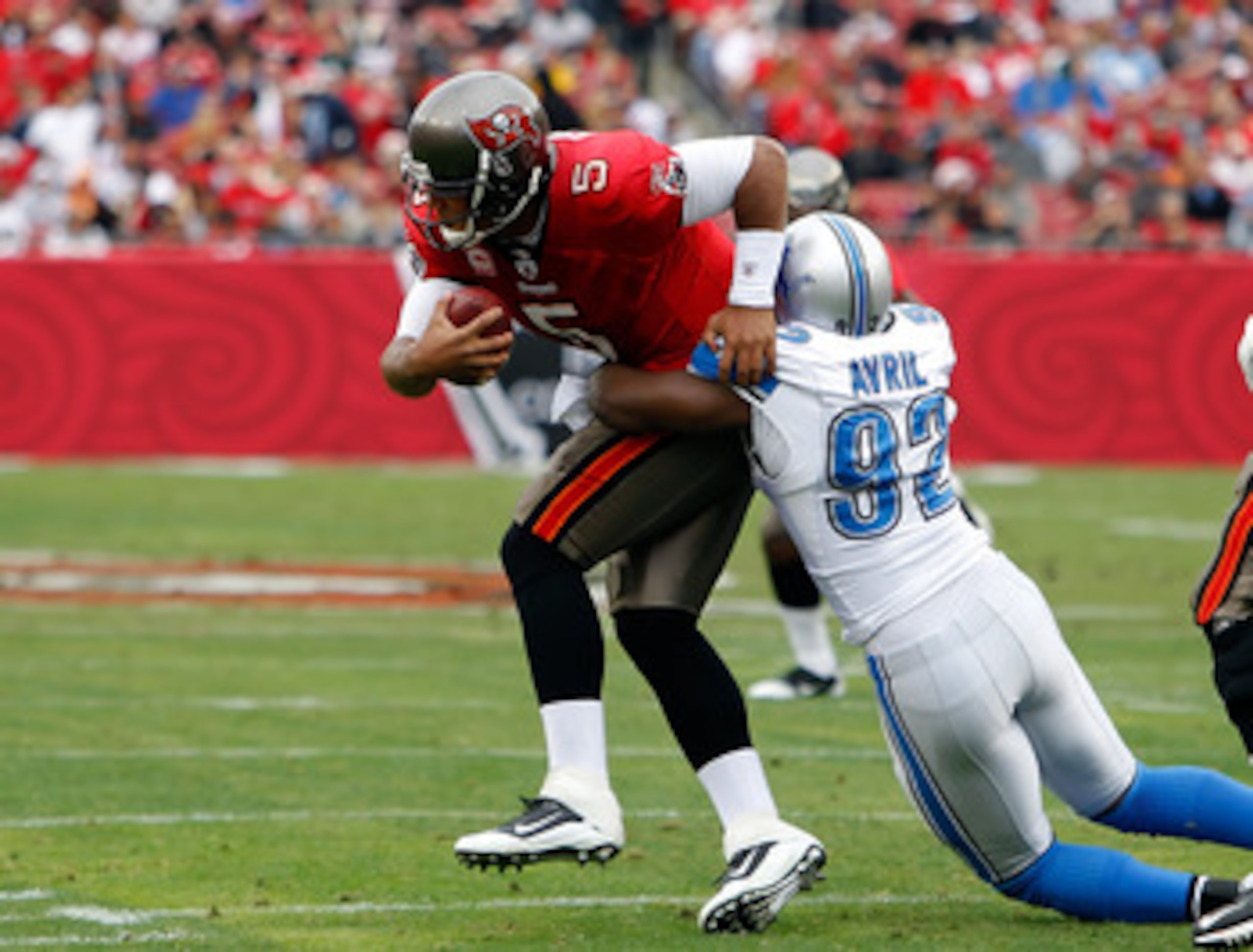 TAMPA, FL - DECEMBER 19: Defensive end Cliff Avril #92 of the Detroit Lions sacks quarterback Josh Freeman #5 of the Tampa Bay Buccaneers during the game at Raymond James Stadium on December 19, 2010 in Tampa, Florida. (Photo by J. Meric/Getty Images) TAMPA, FL - DECEMBER 19: Defensive end Cliff Avril #92 of the Detroit Lions sacks quarterback Josh Freeman #5 of the Tampa Bay Buccaneers during the game at Raymond James Stadium on December 19, 2010 in Tampa, Florida. (Photo by J. Meric/Getty Images)