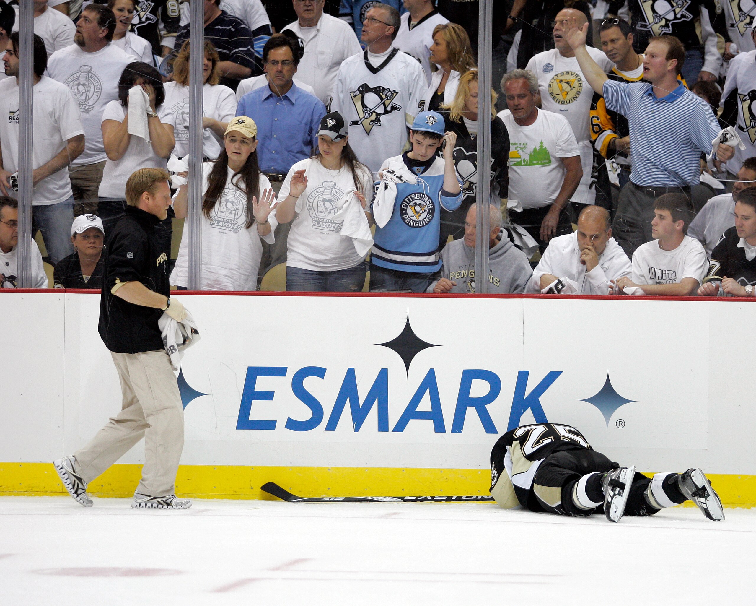PITTSBURGH, PA - APRIL 27:  Maxime Talbot #25 of the Pittsburgh Penguins lies on the ice after being checked into the board against the Tampa Bay Lightning in Game Seven of the Eastern Conference Quarterfinals during the 2011 NHL Stanley Cup Playoffs at C