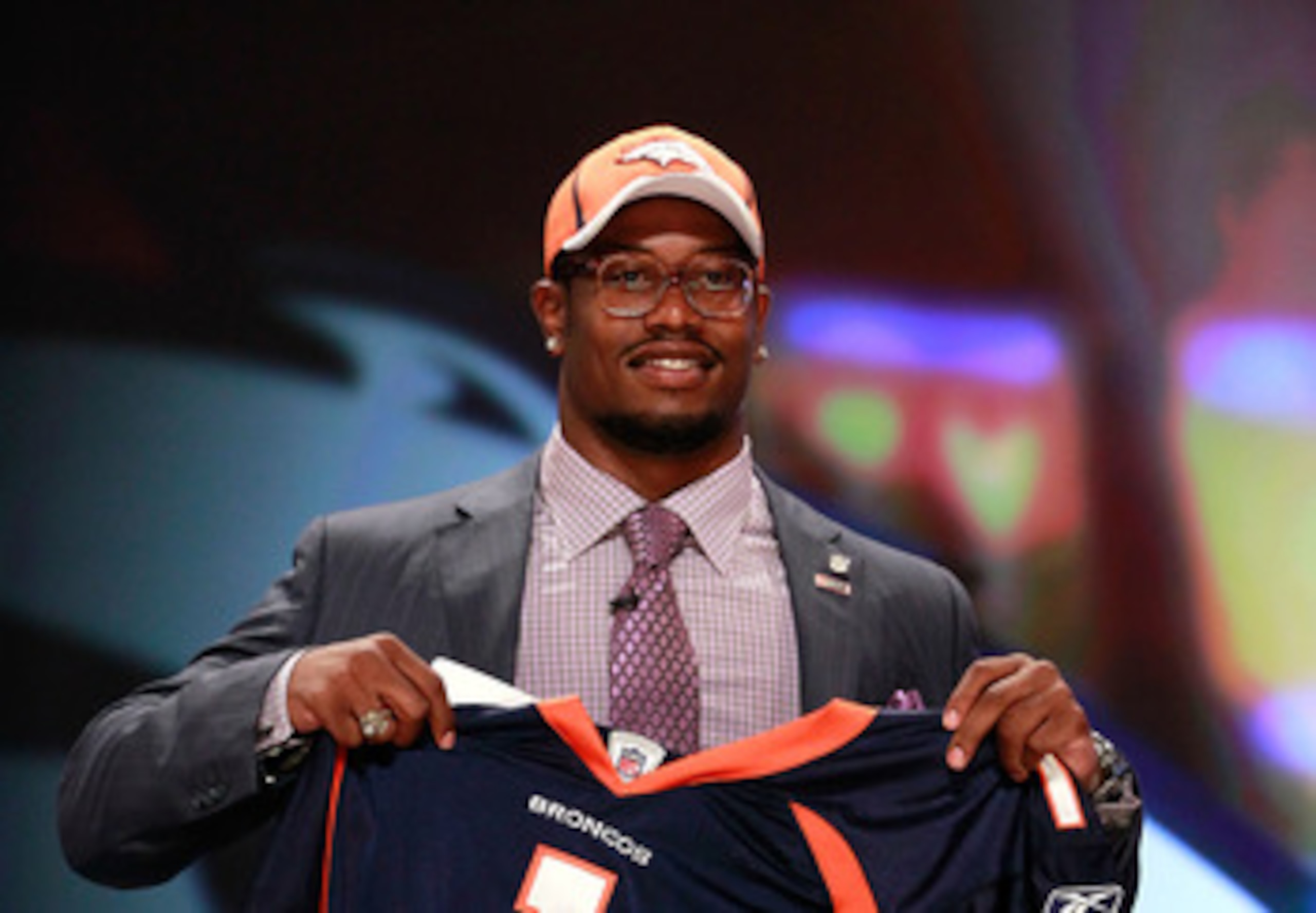NEW YORK, NY - APRIL 28:  Von Miller, #2 overall pick by the Denver Broncos holds up a jersey on stage during the 2011 NFL Draft at Radio City Music Hall on April 28, 2011 in New York City.  (Photo by Chris Trotman/Getty Images)